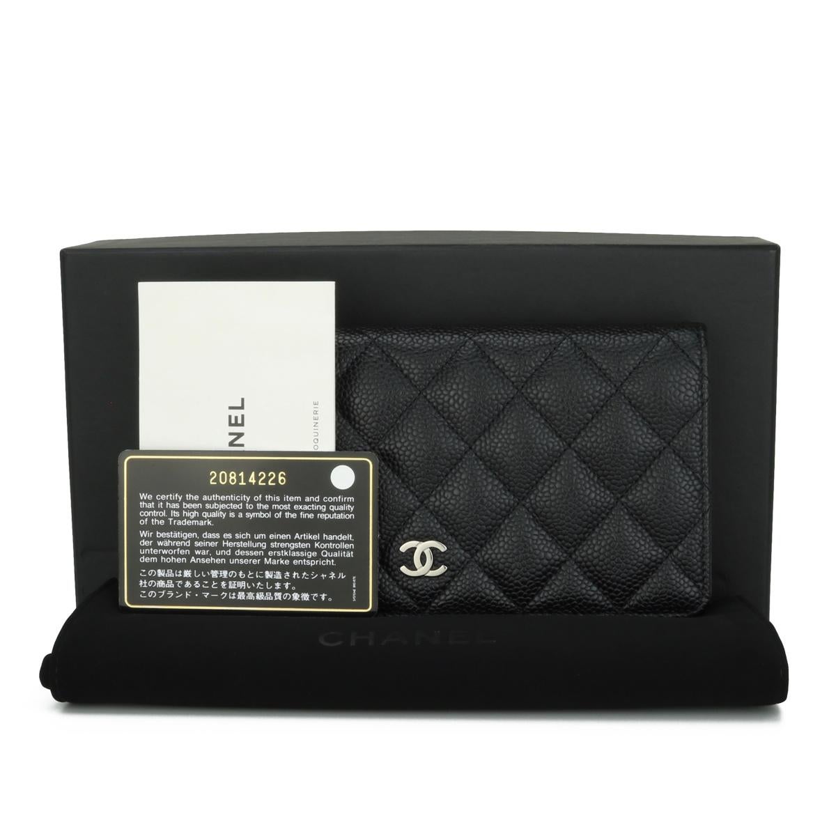 Chanel Quilted Classic Long Flap Yen Wallet in Black Caviar with Silver Hardware 2015.

This stunning wallet is in excellent condition, the wallet still holds its original shape, and the hardware is still very shiny.

- Exterior Condition: Excellent