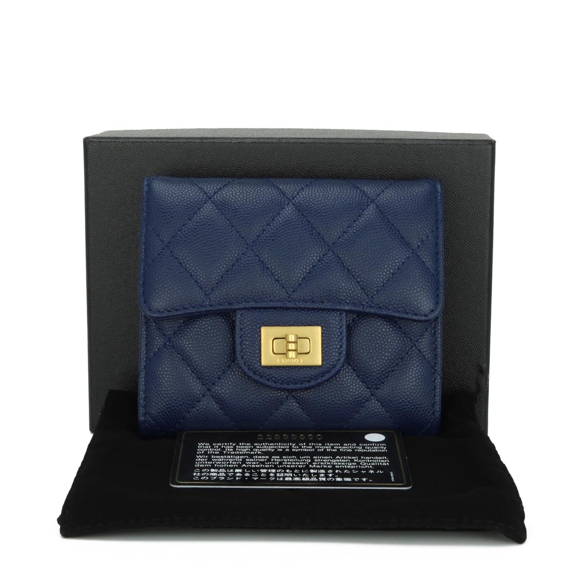 Chanel Quilted 2.55 Classic Small Flap Wallet in Navy Blue Caviar with Gold Hardware 2017.

This stunning classic wallet is in never worn condition. The wallet still holds its original shape, and the hardware is still very shiny.

- Exterior