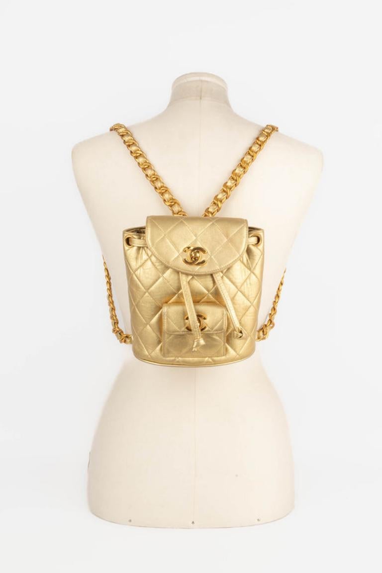 Chanel - (Made in France) Quilted golden lamb leather backpack with golden metal elements. Piece with a serial number. 1991/1994 Collection.

Additional information: 
Condition: Very good condition
Dimensions: Height: 17 cm - Length: 16 cm - Depth: