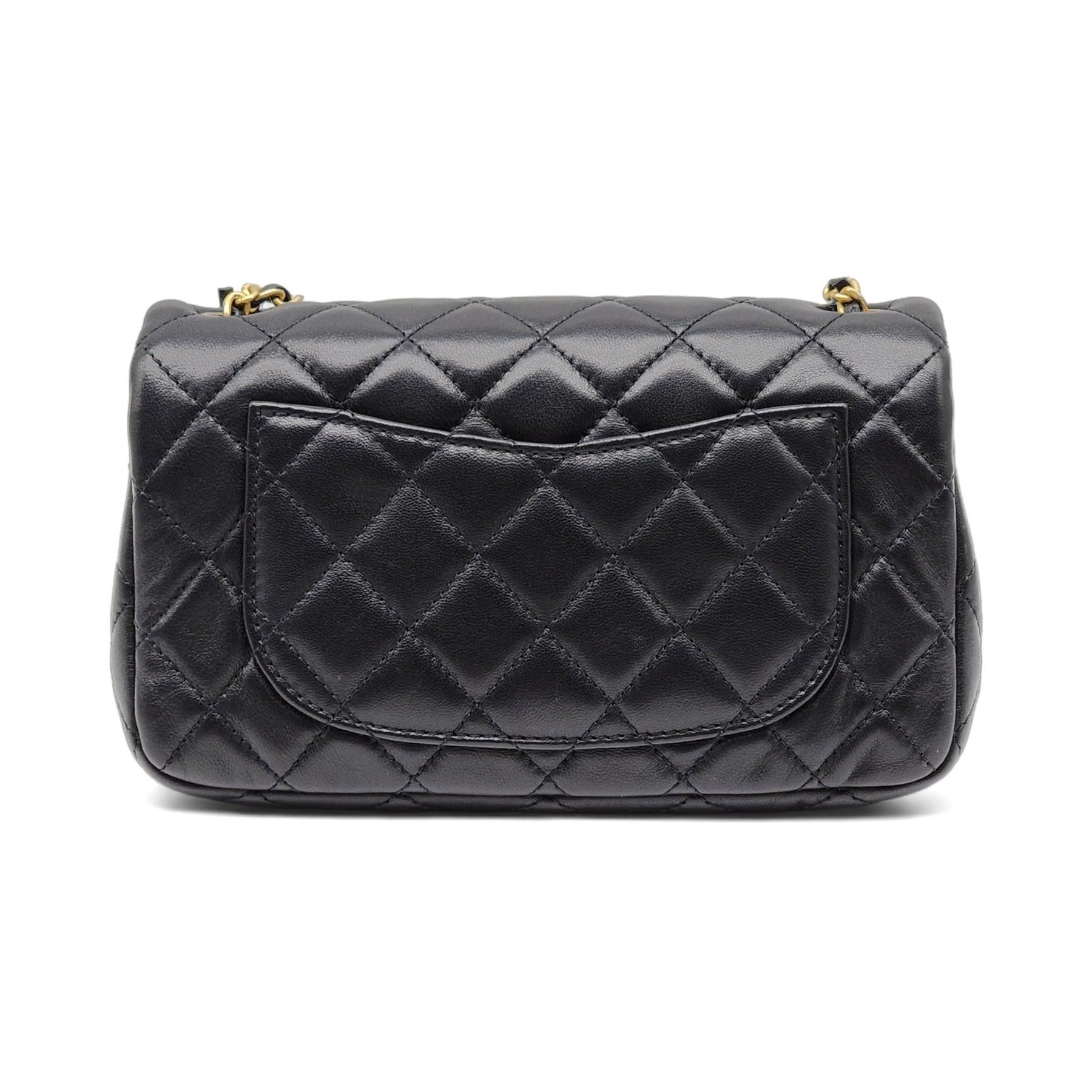Chanel Quilted Lambskin Leather Pearl Crush Mini Flap Bag in Black.

Additional information:
Material: Leather
Color: Black
Country: Italy
Dimension: 8