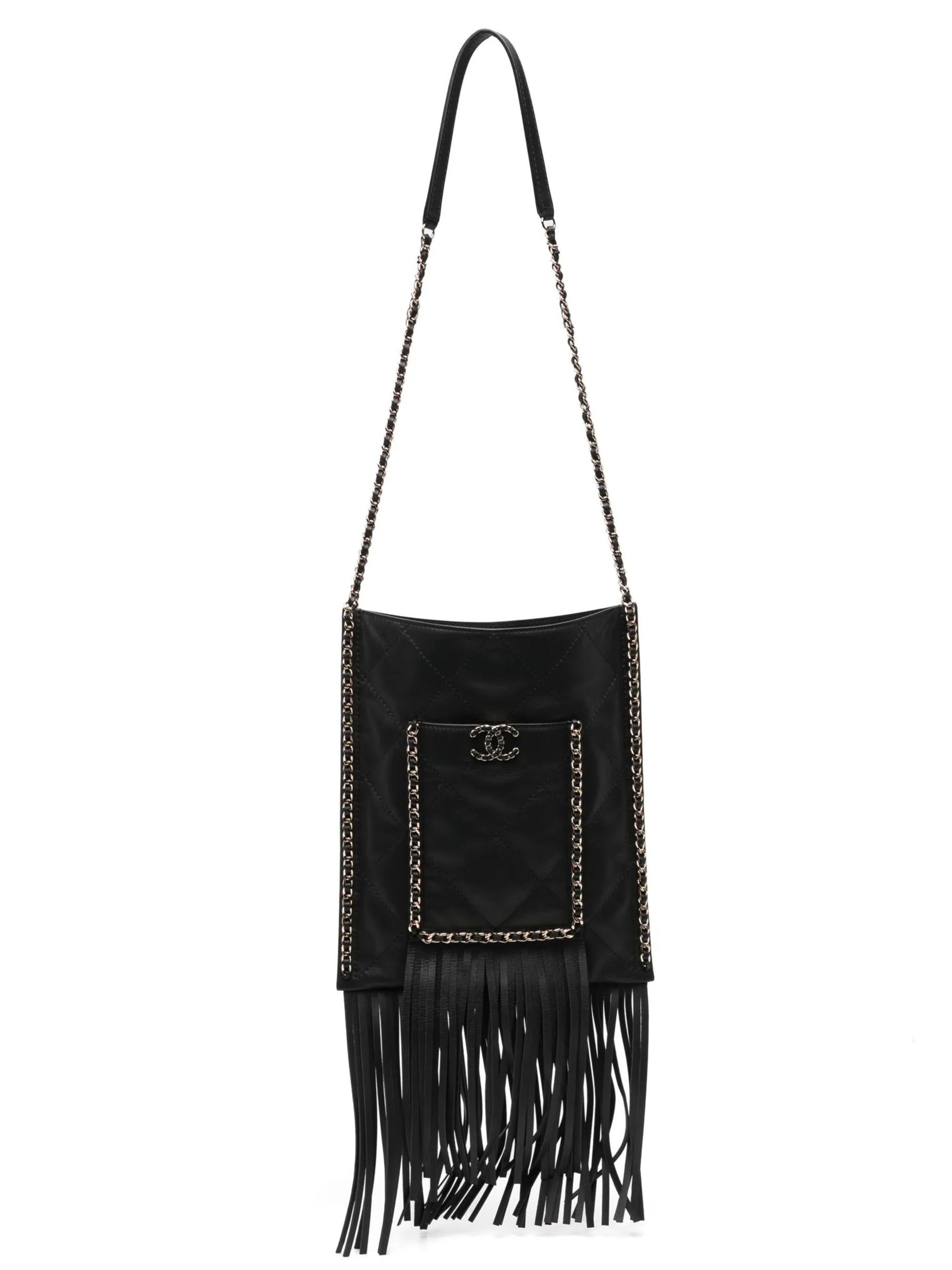- 2022 Chanel Cruise collection
- Black
- Fringe shopping bag
- Magnetic fastening
- Signature diamond quilting
- Fringe ends
- Leather chain strap
- Front pocket
- Gold-toned hardware
- Black fabric interior
- Comes with original box and dust