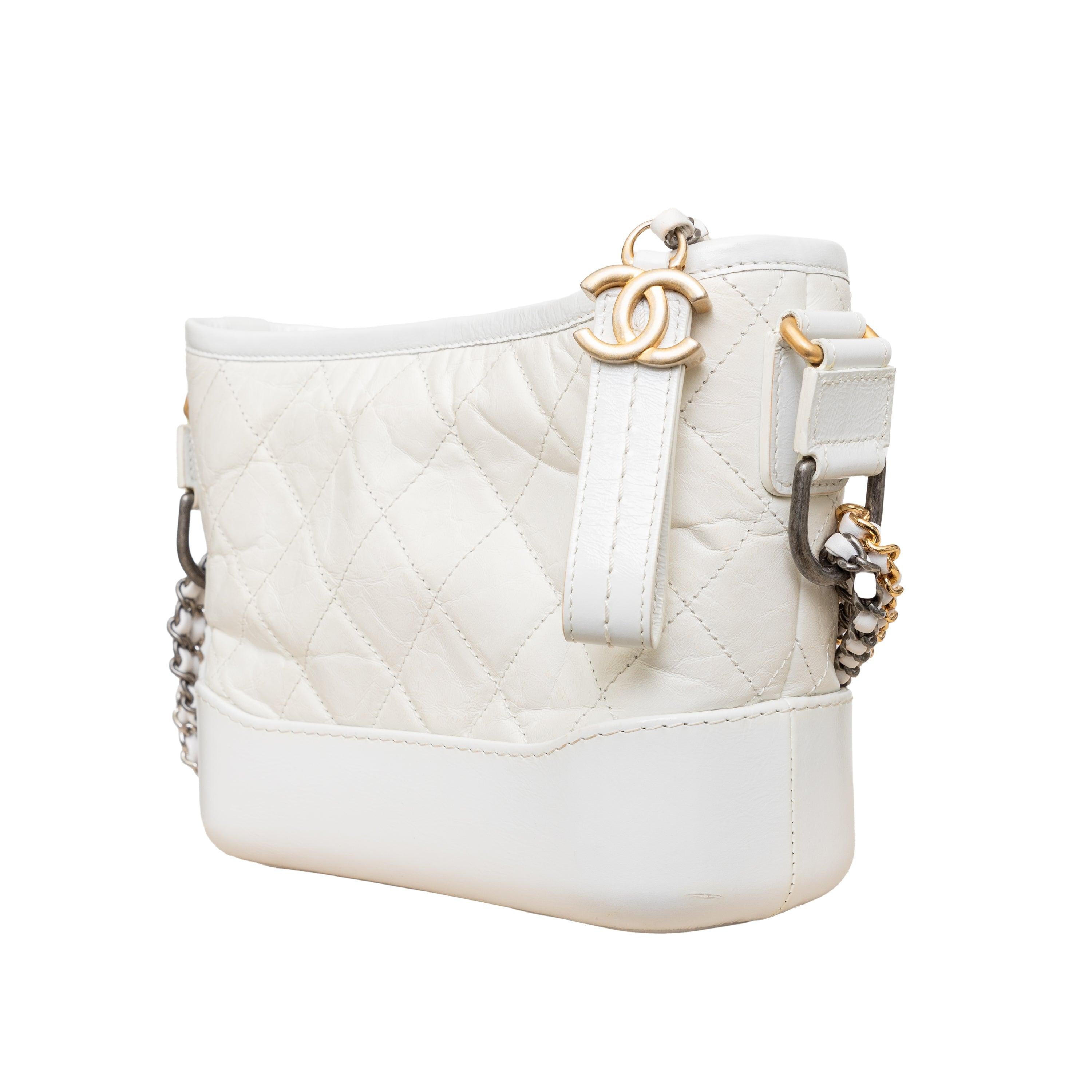 The Chanel Gabrielle hobo, originally released for Spring 2017, draws inspiration from Gabrielle Chanel. With a sleek and modern design, this off-white handbag is crafted from quilted leather, evoking an elegant and enduring aesthetic. It features a