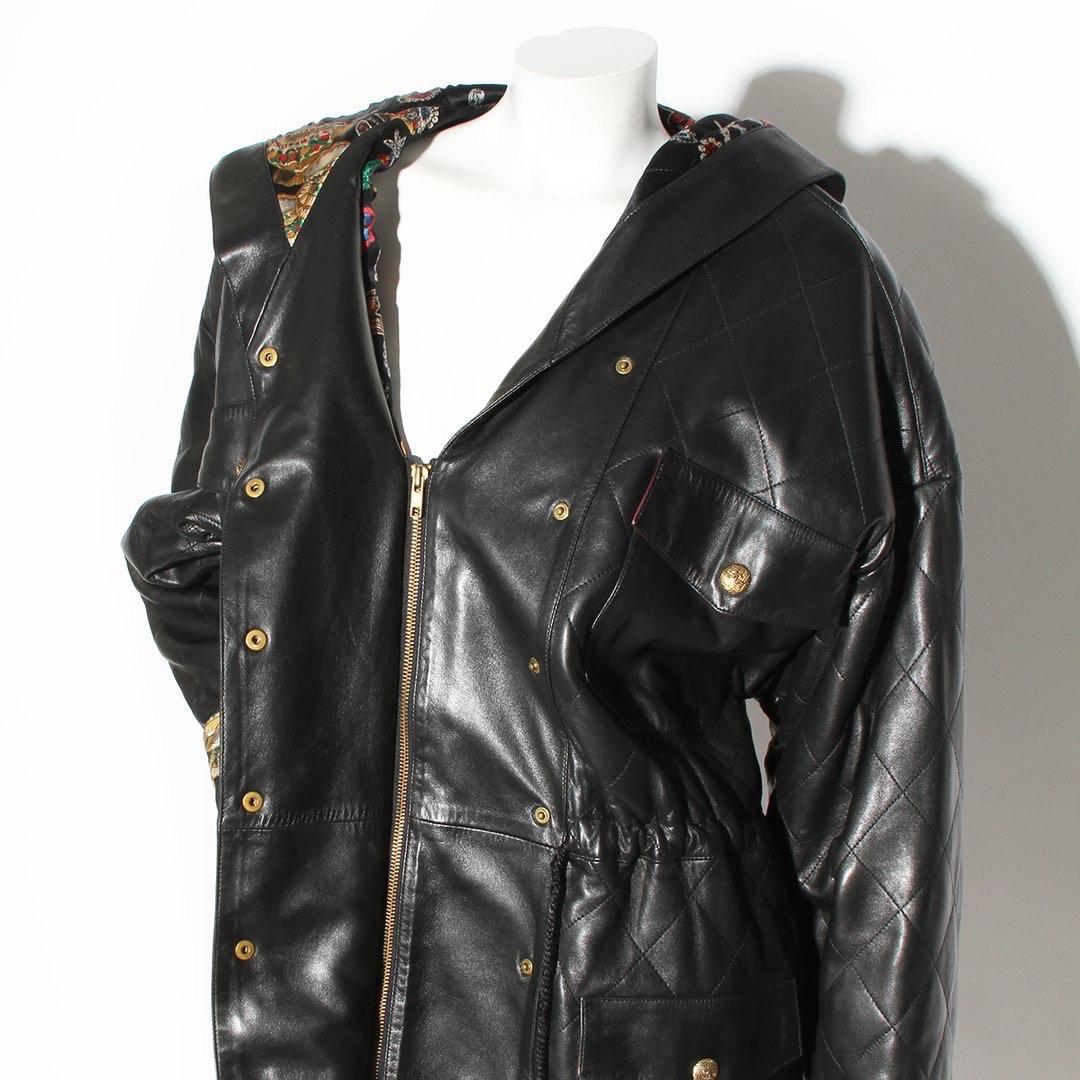 Vintage Chanel by Karl Lagerfeld Parka Coat 
Vintage 
Circa early 1990's 
Made in France
Oversize fit
Black Lambskin
Quilted stitch detailing 
Zipper down front of coat 
Snap closures on front of jacket 
Gold button details with interlocked CC