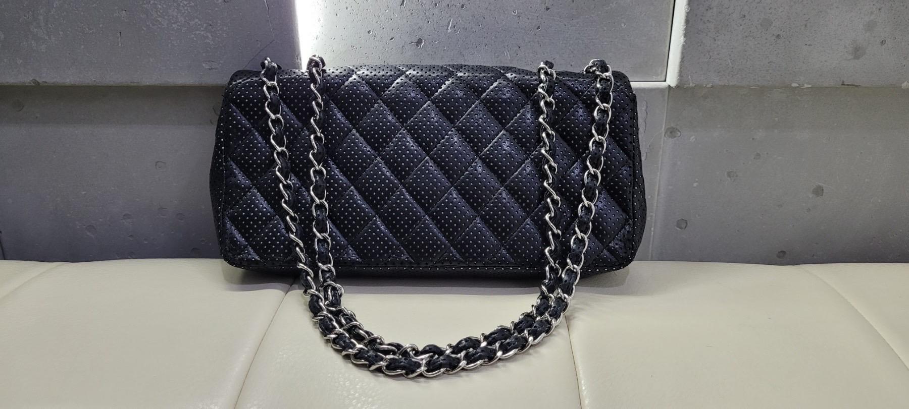     Chanel Shoulder Bag
    By Karl Lagerfeld
    Neutrals Leather
    Interlocking CC Logo, Quilted Pattern & Chain-Link Accent
    Silver-Tone Hardware
    Chain-Link Shoulder Straps
    Leather Lining & Dual Interior Pockets
    Flap Closure at