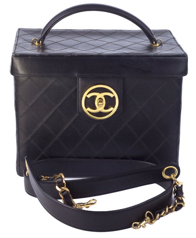 Chanel quilted vanity case bag in black from the 90's, it comes with a removable shoulder strap.