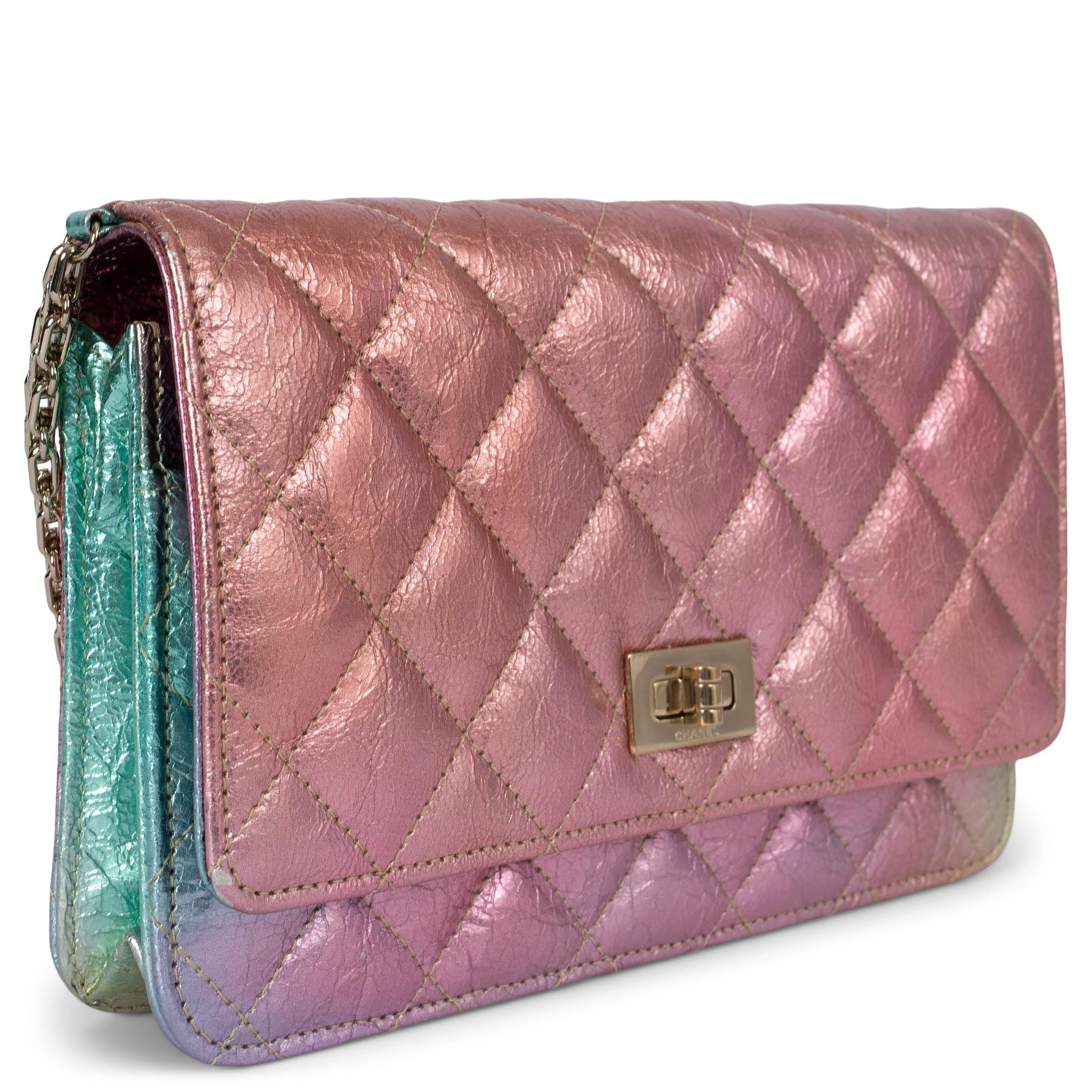 100% authentic Chanel Mermaid 2.55 Reissue WOC wallet on chain bag in metallic rainbow aged calfskin leather. Features an open pocket on the outside back, an open pocket on the front under the flap, love letter zipper pocket in the flap and light