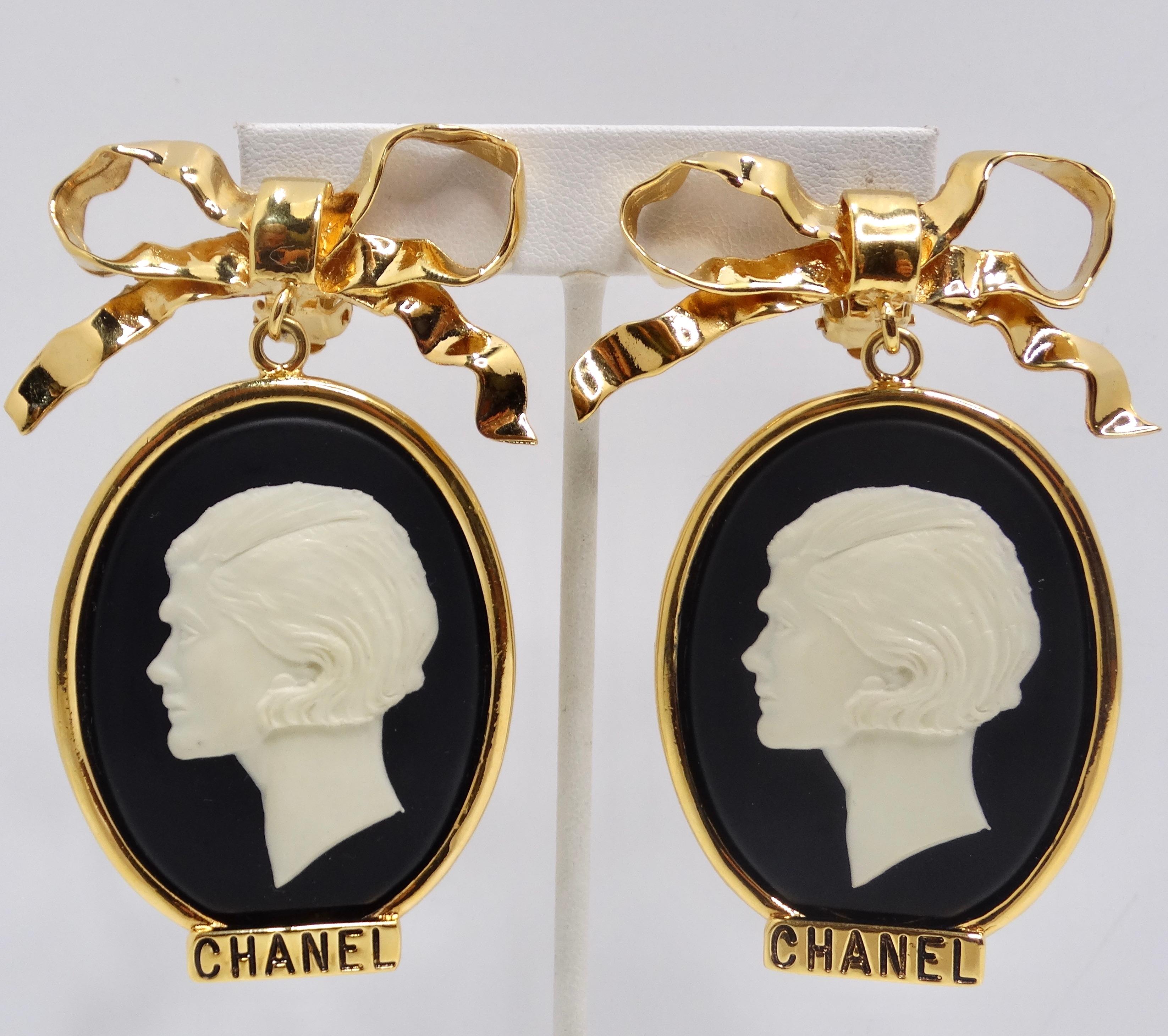 Introducing a true treasure for Chanel enthusiasts – the Rare 1980s Large Gold Tone Cameo Earrings. These stunning statement earrings are not just accessories; they are a homage to the iconic Coco Chanel, featuring a striking black and white large