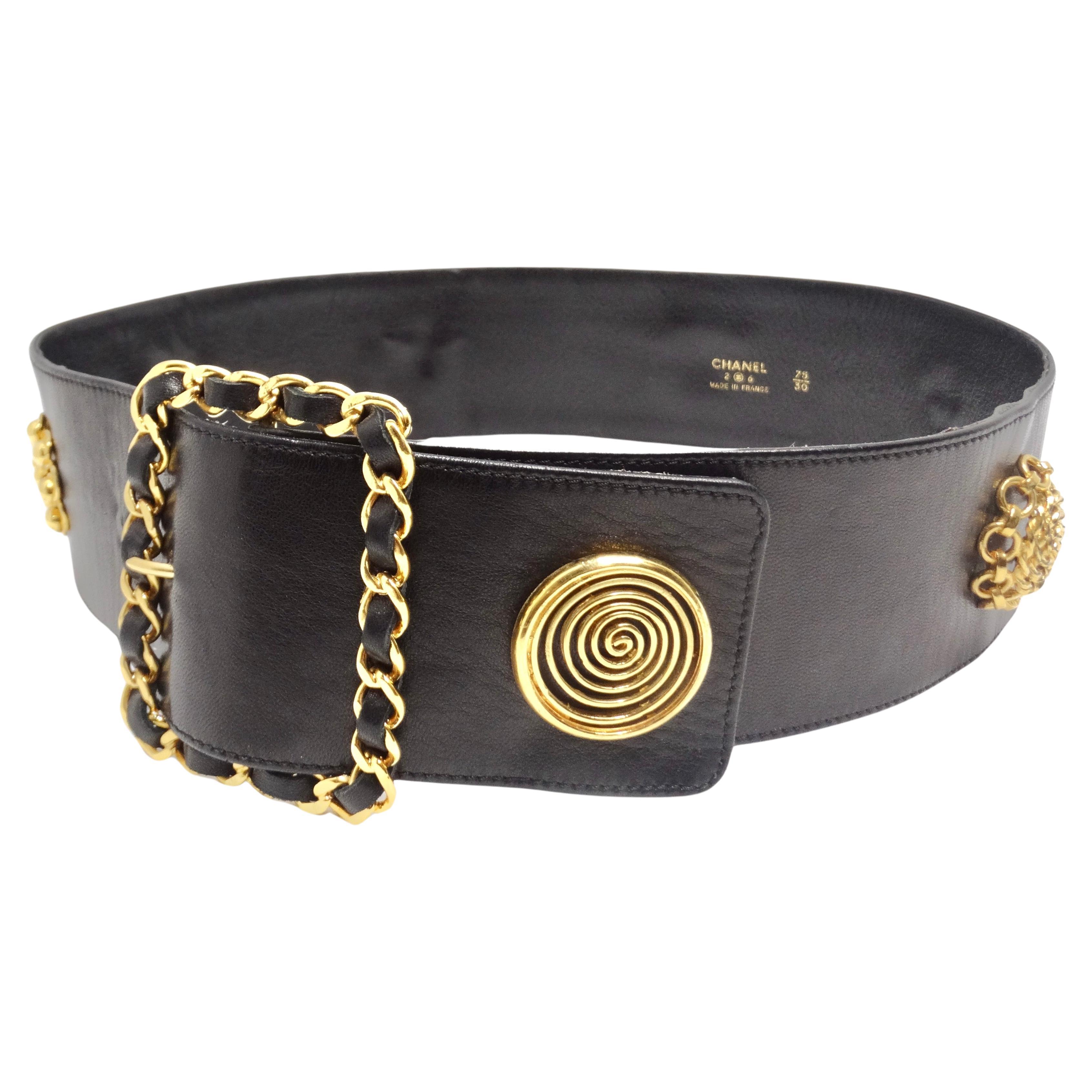 Step into the world of rare and timeless elegance with the Chanel Rare 1980s Victoire De Castellane Gold Tone Black Leather Belt. This incredible black leather statement piece showcases a signature Chanel leather-intertwined chain square belt