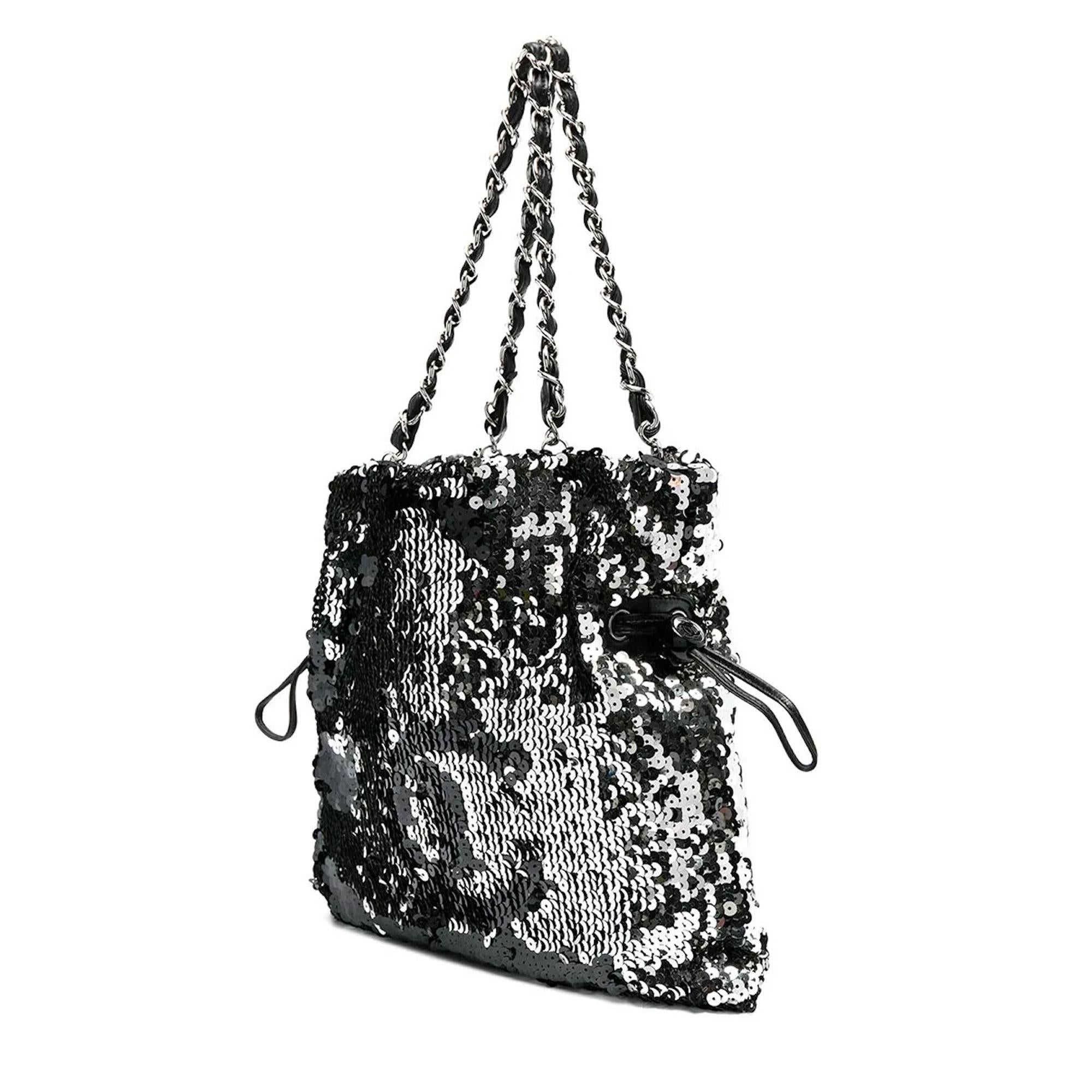 Chanel Rare 2008 Timeless Metallic Sequin Faux Drawstring CC Reversible Small Rare Silver Tote

circa 2008
silver-tone
sequin embellishment
signature interlocking CC logo
two leather and chain-link shoulder straps
faux drawstring fastening
main