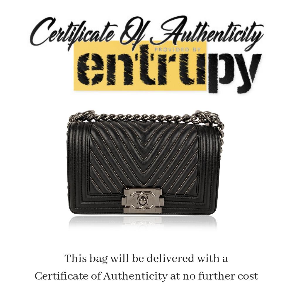 Chanel Rare 2014 Herringbone Chevron Silver Embroidered Boy Bag

Rare Chanel Small 'Boy' shoulder bag in black leather, from the grocery themed Chanel's 2014/2015 Fall/Winter bag collection. The bag was designed by Karl Lagerfeld and takes its name