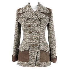 Veste en tweed CHANEL avec boutons en or 64 carats