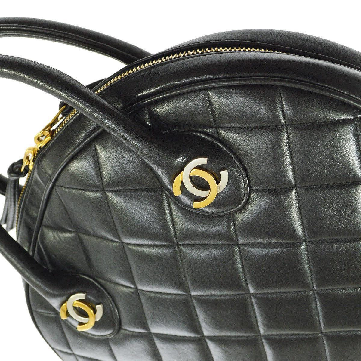 Chanel Rare Black Quilted Leather Gold Silver Top Handle Satchel Bowling Bag

Leather
Gold and silver tone hardware
Zipper closure
Leather lining
Date code present
Made in France
Handle drop 3