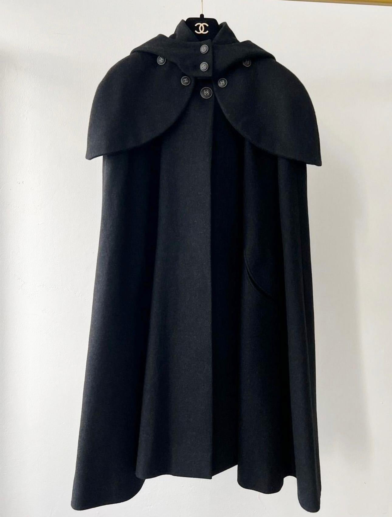 Collectible Chanel black cashmere cape coat with CC logo buttons. Boutique price was ca. 9,000$
Tonal silk lining with camellias
Size mark 36 FR. Never worn.