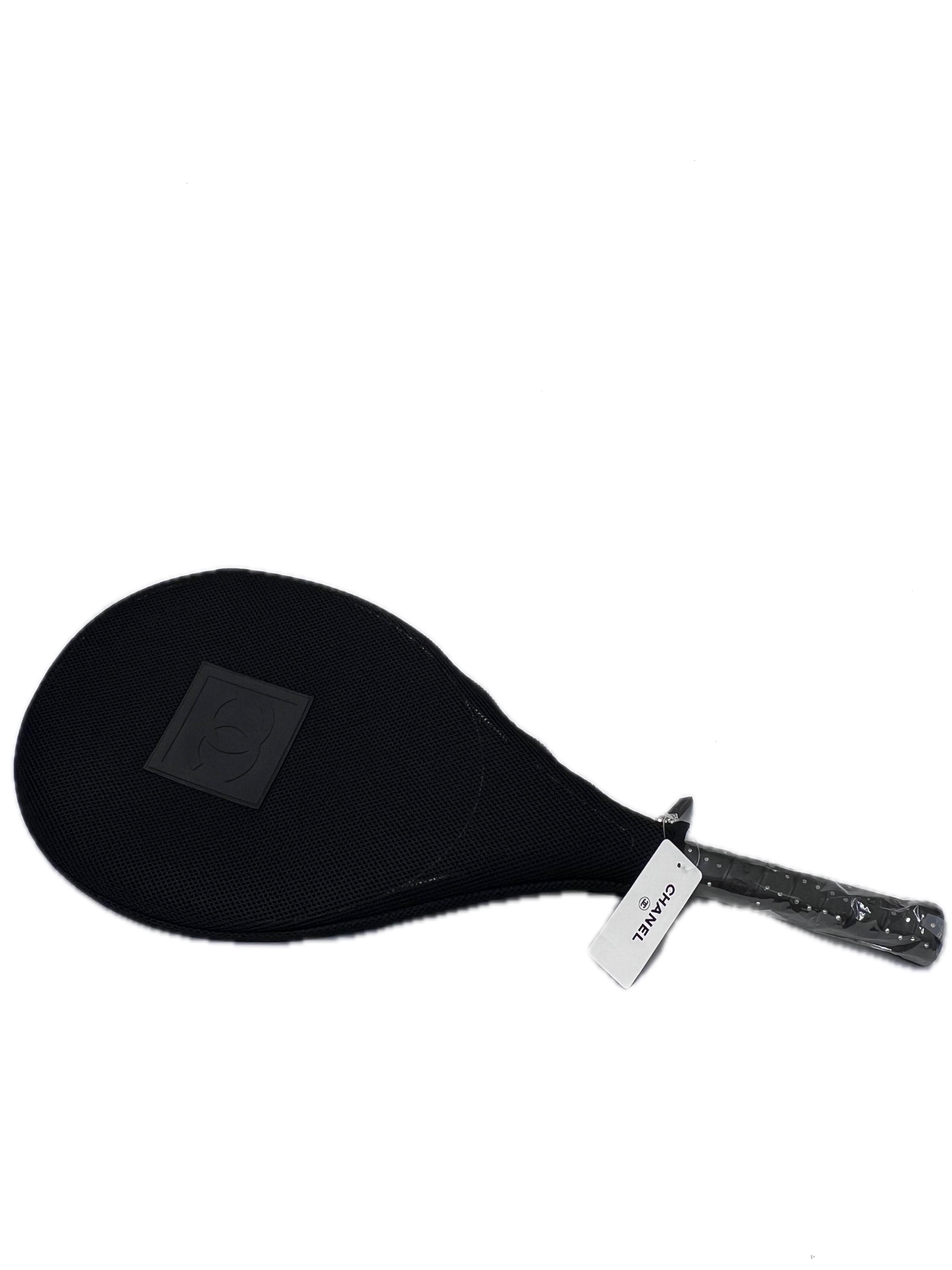 Elevate your game with this exclusive and ultra-rare Chanel CC Logo Tennis Racquet, complete with a luxurious carrying case. Adorned with delicate rhinestones on the handle, this racquet seamlessly blends sport and style, exuding the elegance that