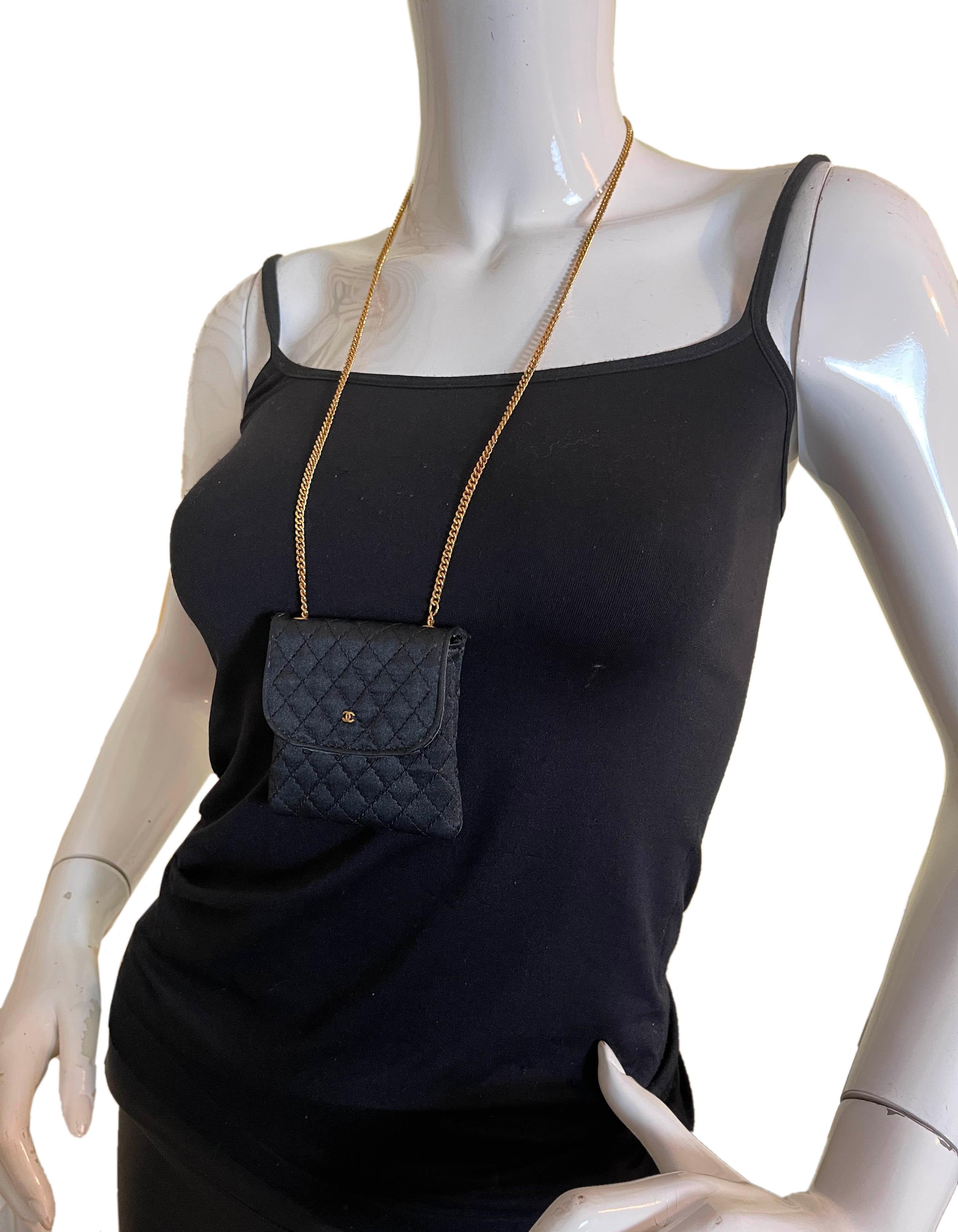 Chanel Black Vintage Quilted Satin Micro Flap Bag Necklace

Made In: France
Year of Production: 1990s
Color: Black
Hardware: Goldtone
Materials: Satin
Lining: Leather
Closure/Opening: Flap top with snap
Exterior Pockets: N/A
Interior Pockets: