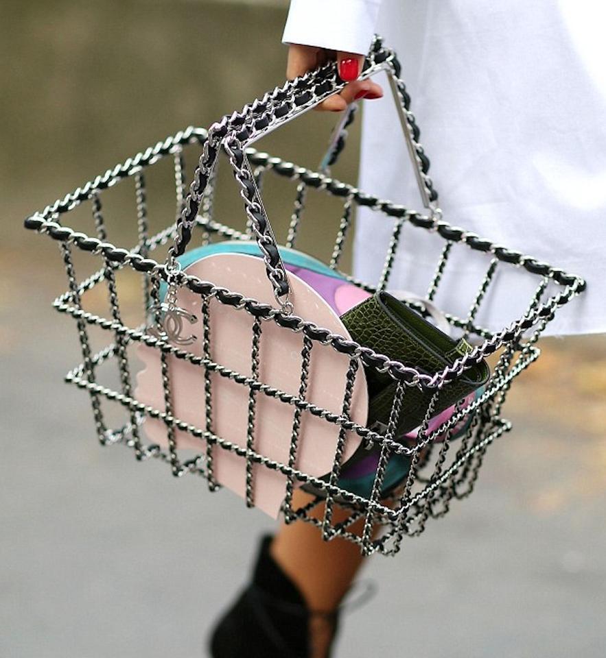 Chanel classic silver interwoven chain in the form of a large sized grocery shopping basket

Spring 2014
Silver hardware
Classic interwoven chain
CC Silver Charm
Can be used for high fashion or interior decor
8.5