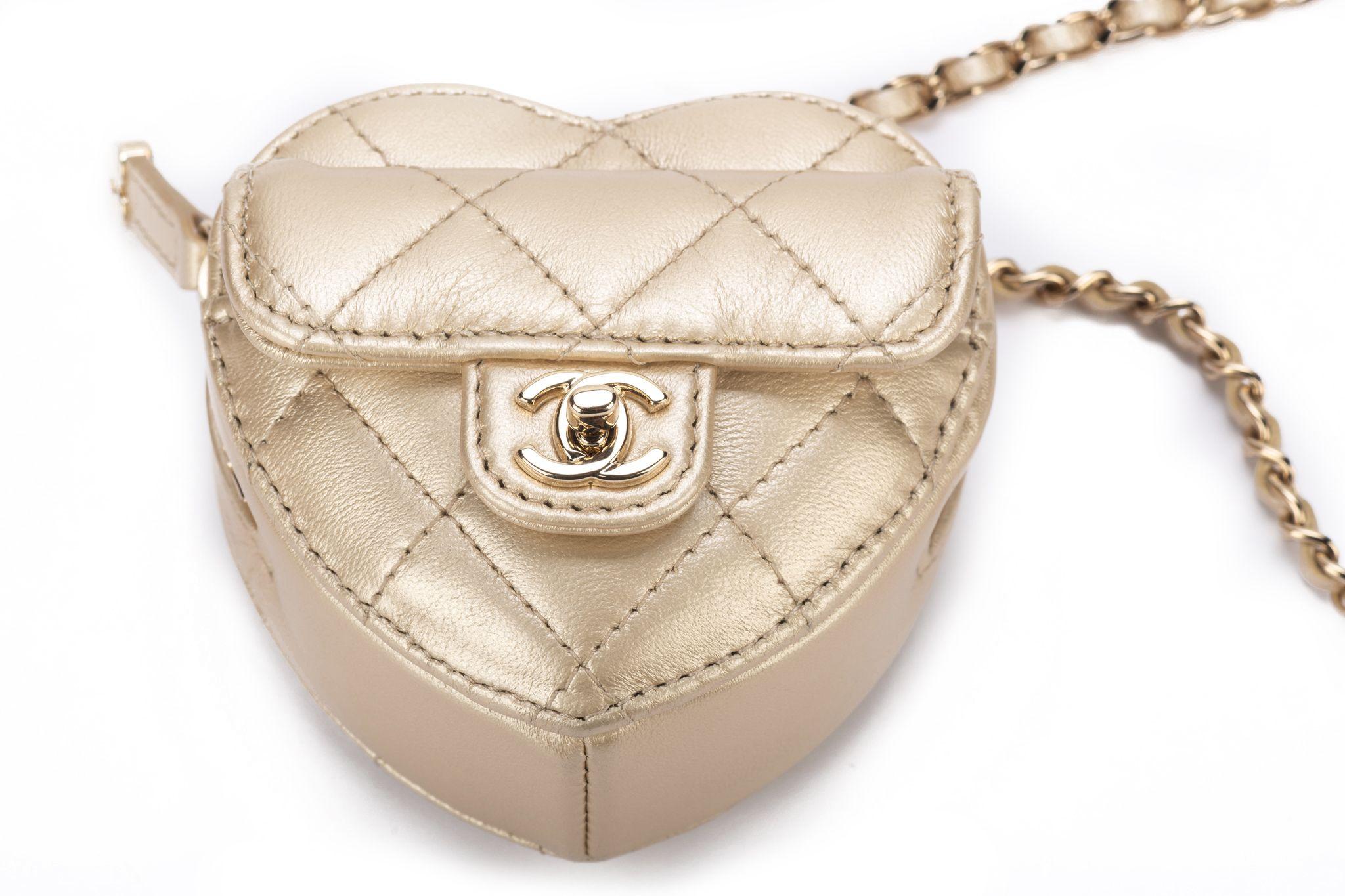 Chanel sold out worldwide and collectible heart shaped necklace. Quilted champagne gold leather, Chain 17.5”. Can be used as a air pods pouch also. Collection 32. Comes with hologram, ID card, dust cover and original box.