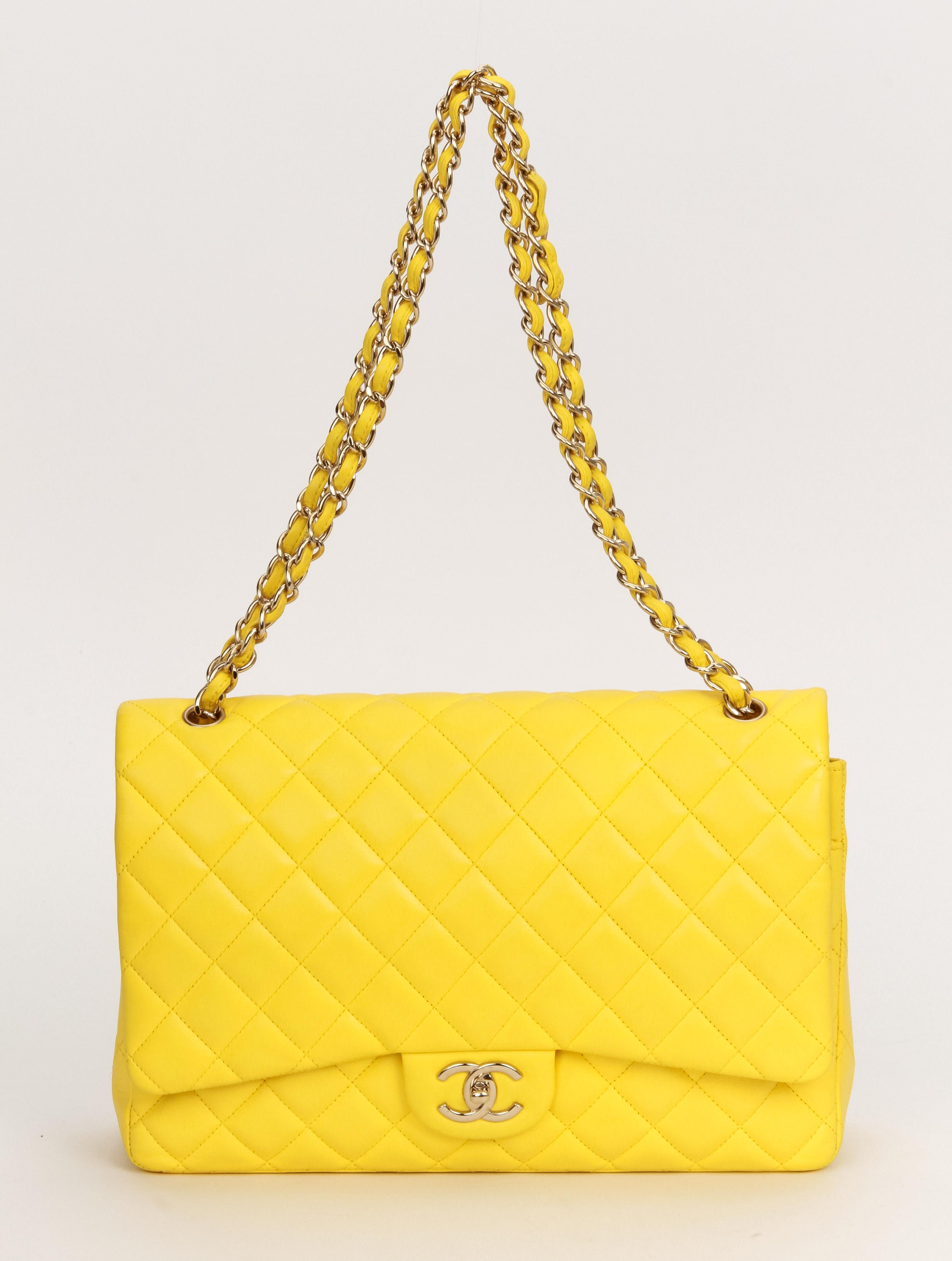 Chanel rare and collectible yellow lambskin maxi double flap with gold tone hardware. Excellent condition, minor signs of wear. Can be worn shoulder or cross body. Store price $9200 plus tax. Collection 15, 2011. Comes with hologram and original
