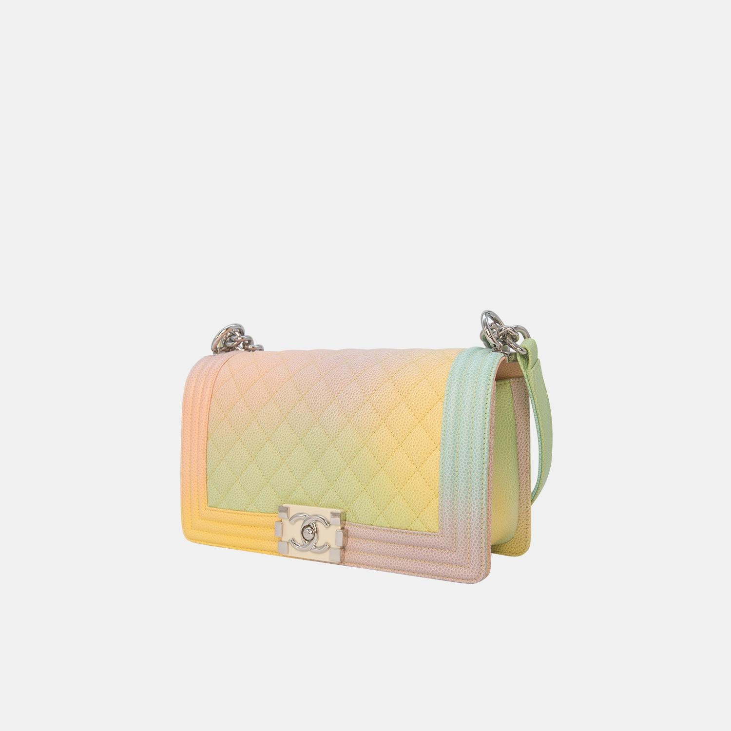 Karl Lagerfeld transformed the Grand Palais into a stunning French Riviera for Chanel's Spring/Summer 2018 collection. This Rainbow Chanel Boy Bag stole the show with its vibrant design. Crafted from iconic caviar leather with diamond quilting in a