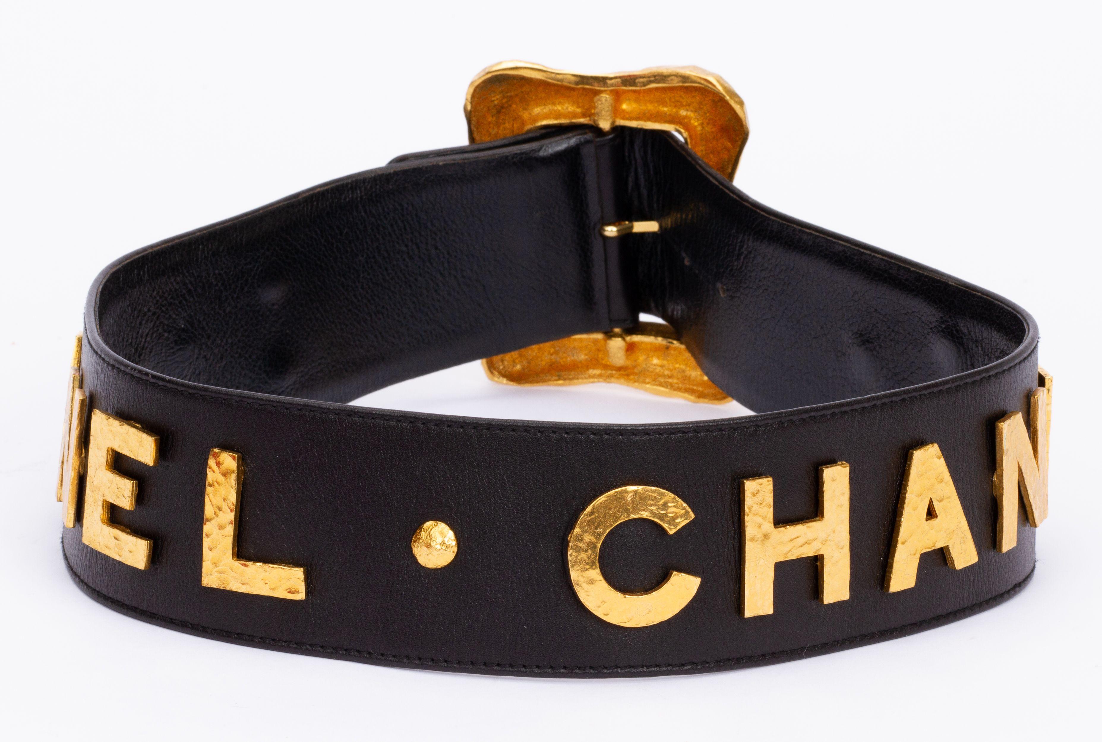 Chanel rare and collectible autumn 93 oversize belt. Black leather with hammered gold lettering. Small size 70cm/28” Buckle dimensions: 4