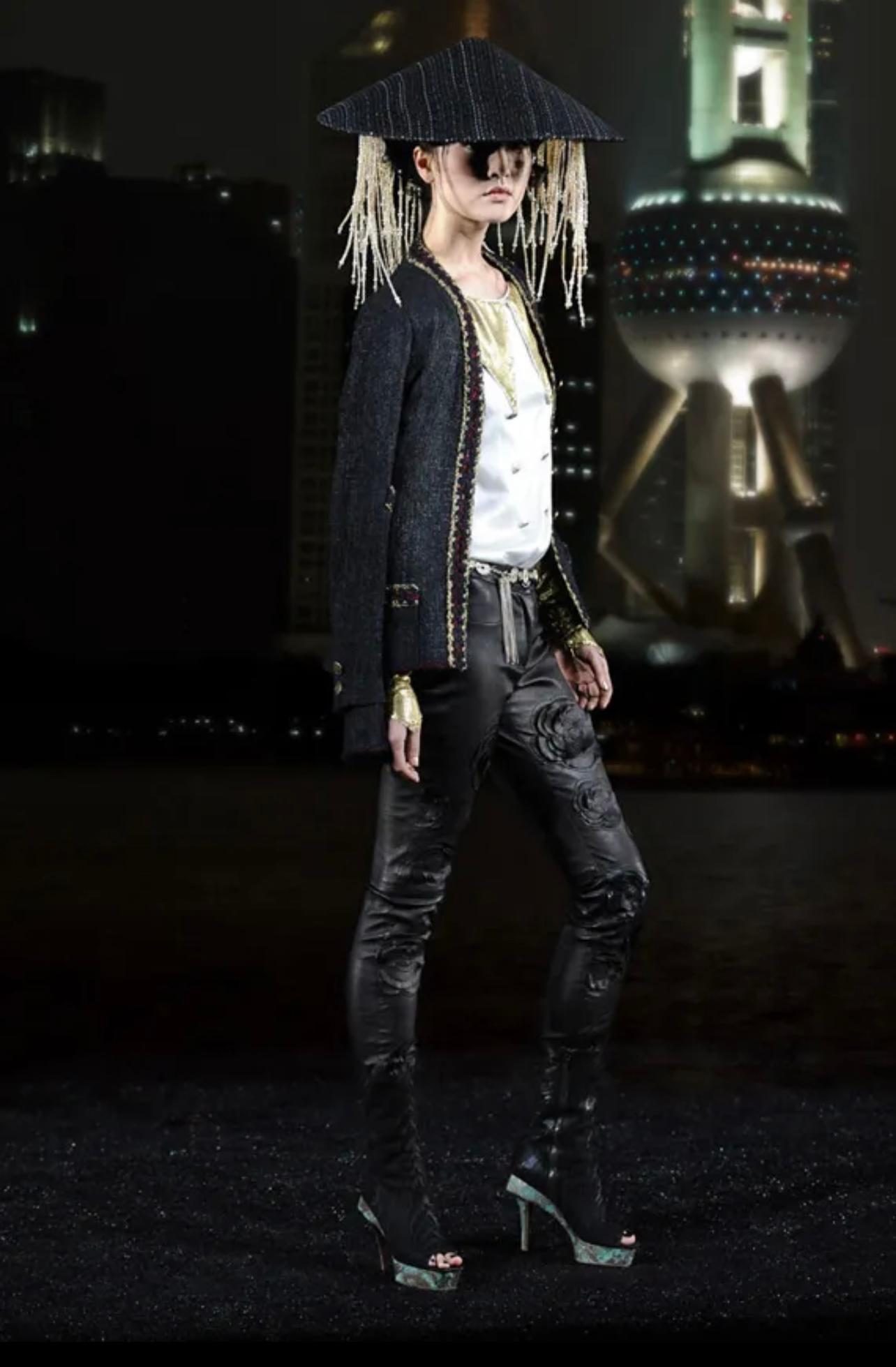 New rarest and iconic Chanel black tweed jacket from Paris / SHANGHAI Collection, Metiers d'Art by Mr Karl Lagerfeld.
- Price on ebay for pre-owned 5,999$
Size mark 34 FR. Condition is pristine
- CC logo antique style 'coin' buttons
- signature