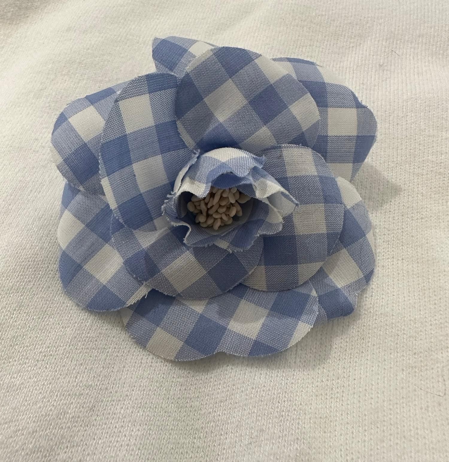 Chanel rare to find S/S 1995 blue & white gingham fabric camellia flower pin from S/S 1995. Lovely flower in great condition. Unfortunately without the box. 
 In excellent wearable condition.  All our clothing & textiles are dry cleaned and