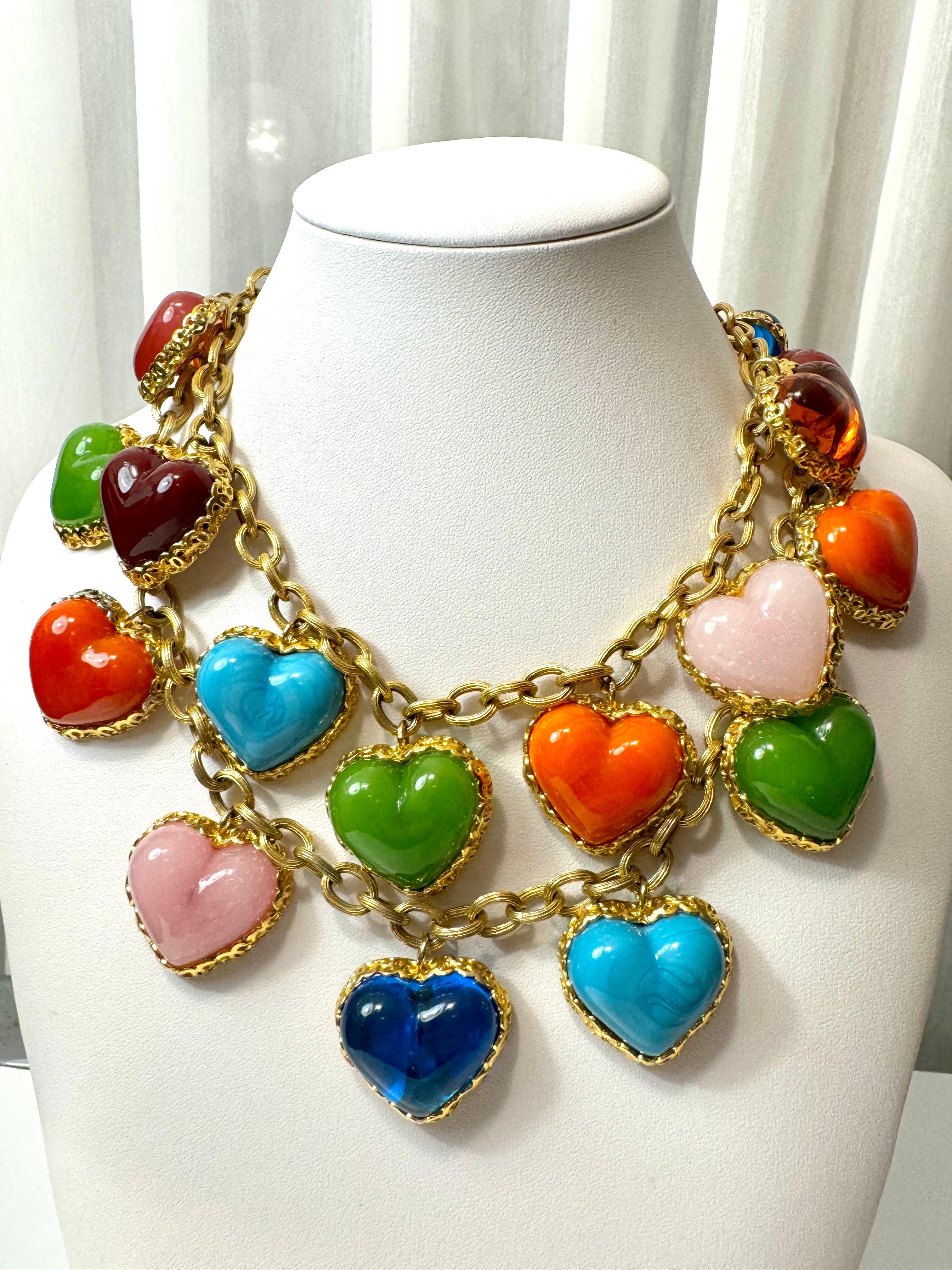 Magnificent vintage CHANEL gripoix necklace that is beyond gorgeous. 
Comprised of poured glass heart charms dangling from 2 strands of gold plated chain with chunky links, the necklace features a stunning and vibrant combination of colors. Each