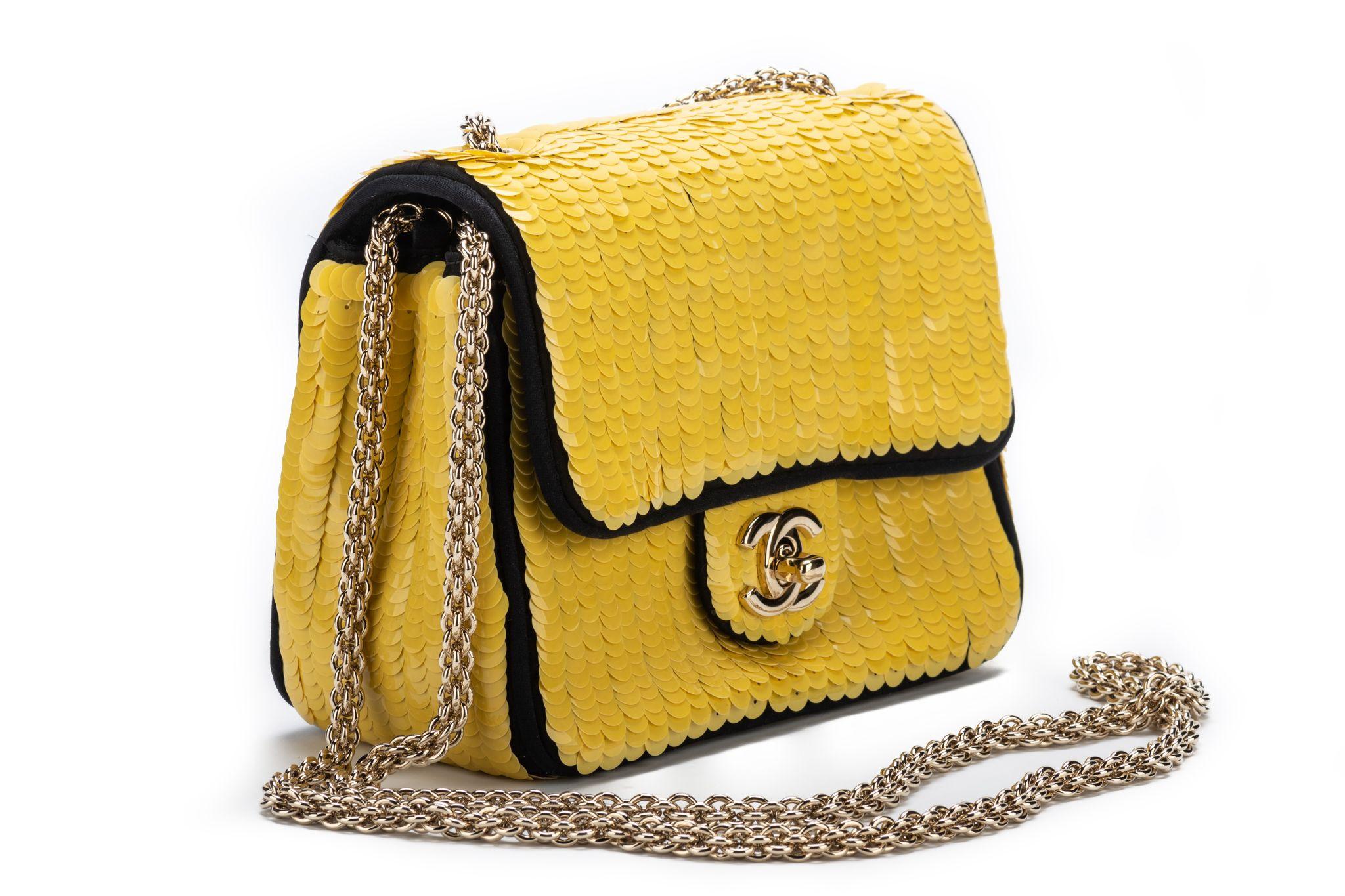 Chanel rare and collectible mint condition yellow sequins square classic flap with black silk interior and piping. Gold tone hardware. Comes with hologram, dust cover, box. Collection 13. Part of the Scuba collection look. Shoulder drop 20.5”.