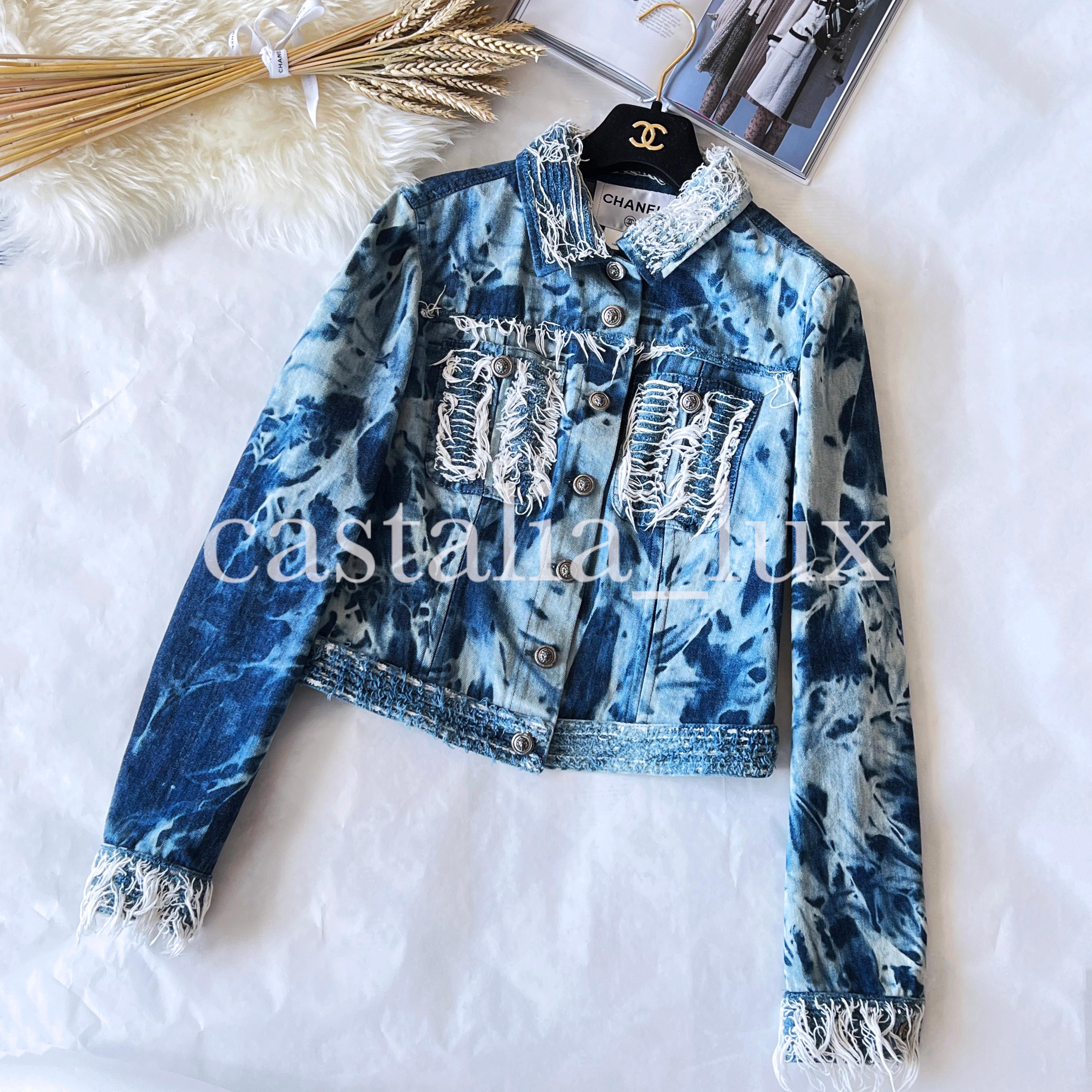 Rarest Chanel blue denim jacket with fringe detail and CC logo lion head buttons. Collectors piece!
Size mark 40 FR. Condition is pristine, no signs of wear.