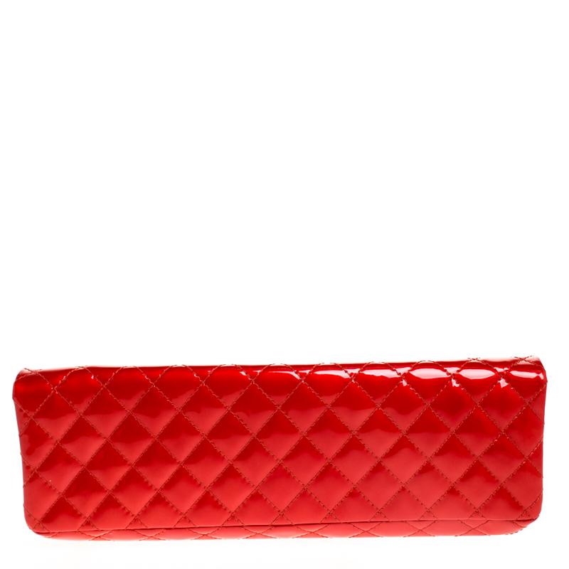 Casual chic, this red Chanel clutch is cute and the perfect match for an evening out. An adorable rendition of the 2.55 Reissue, its glossy patent leather exterior is coupled with the signature quilted pattern, giving it a royal look. Its flap has a