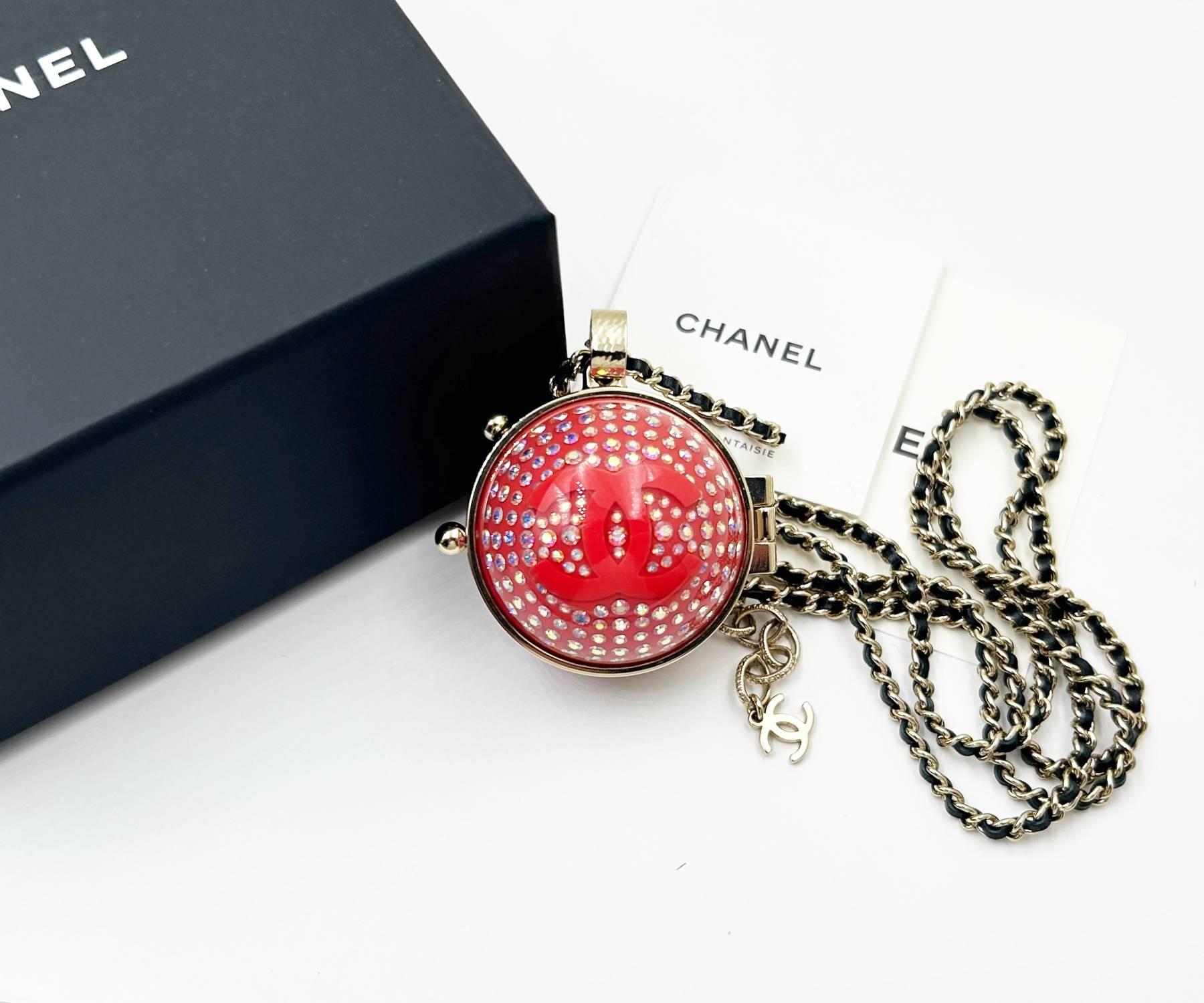 Chanel Red Ball Crystal Mirror Locket Necklace

* Marked 21
* Made in France
* Comes with the original box, pouch and cushion.

-It is approximately 34