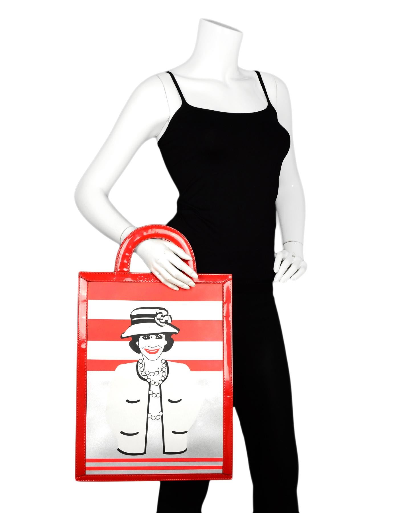 Chanel Red/Black Patent Leather Coco Mademoiselle Portrait Large Tote Bag

Made In: France
Year of Production: 2001
Color: Red, black, white
Hardware: Black
Materials: Patent leather, leather
Lining: Black textile 
Closure/Opening: Open top
Exterior