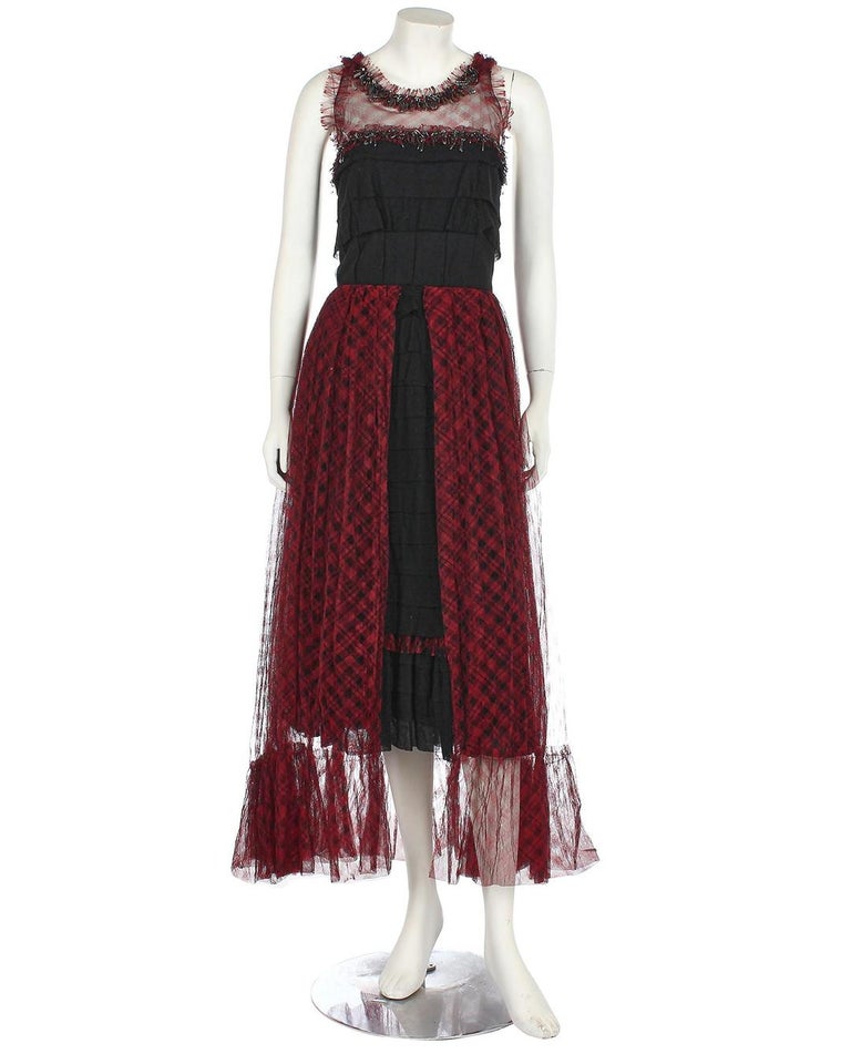 Pre-Fall 2008 Chanel red and black tartan tulle and cotton-jersey dress from the 'Paris-London' Métiers d'Art collection. The bodice is embellished with safety pins, bead fringes and faceted stones. Size 40. Made in France. In excellent