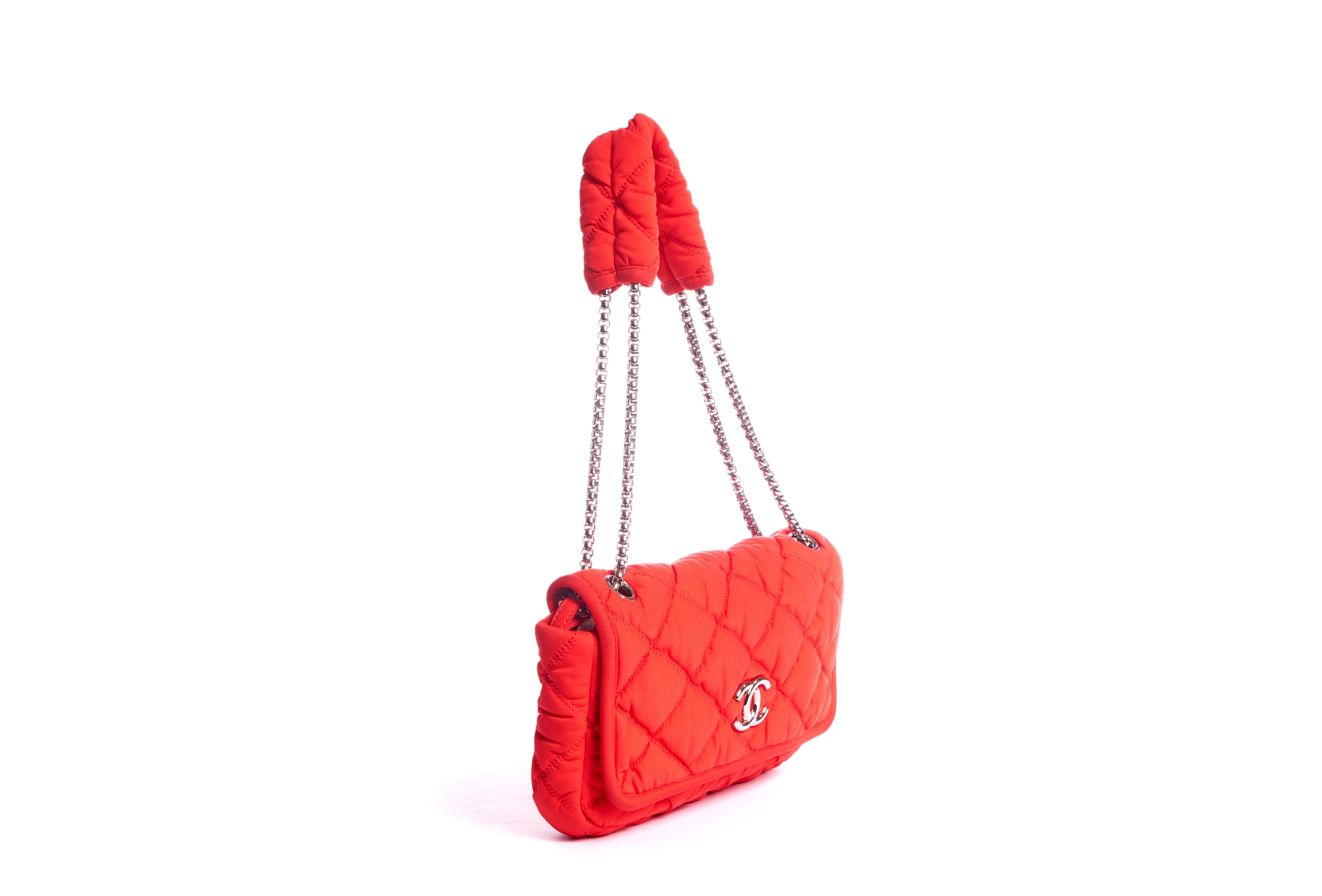 Chanel red nylon bubble bag with single flap and logo. Silver tone hardware. Shoulder drop 10.5