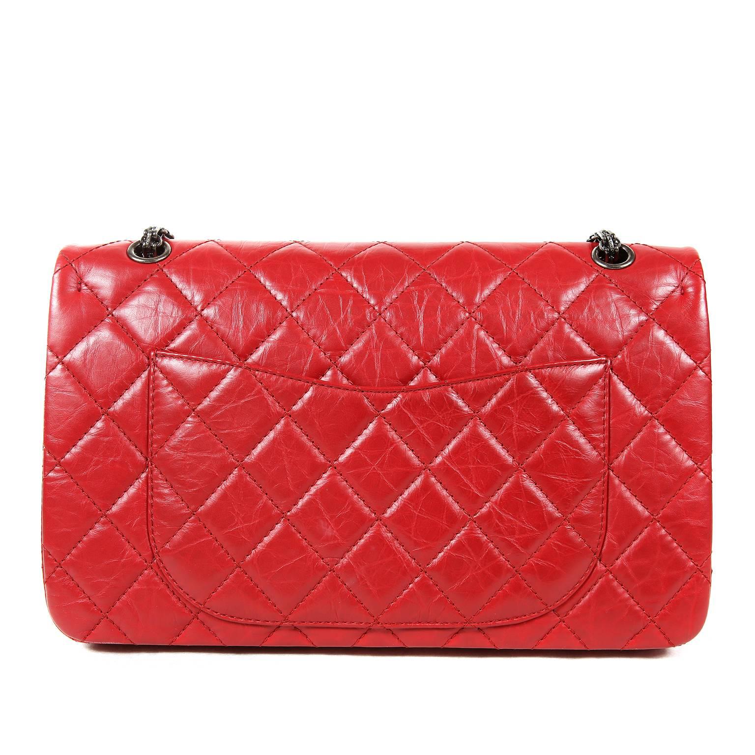 Chanel Red Calfskin 2.55 Reissue Flap Bag- PRISTINE
The particular shade of lipstick red aged calfskin paired with edgy ruthenium hardware makes this collectible Chanel a real head turner.  Largest size available, the 227.
Cherry red aged calfskin