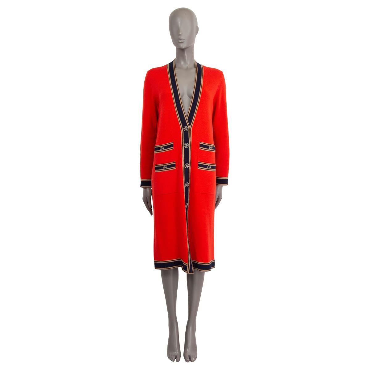 100% authentic Chanel Resort 2020 long cardigan in red, navy and camel cashmere (100%). Features a deep v-neck and four sewn shut buttoned patch pockets. Opens with 'CC' buttons on the front. Unlined. Has been worn once and is in virtually new