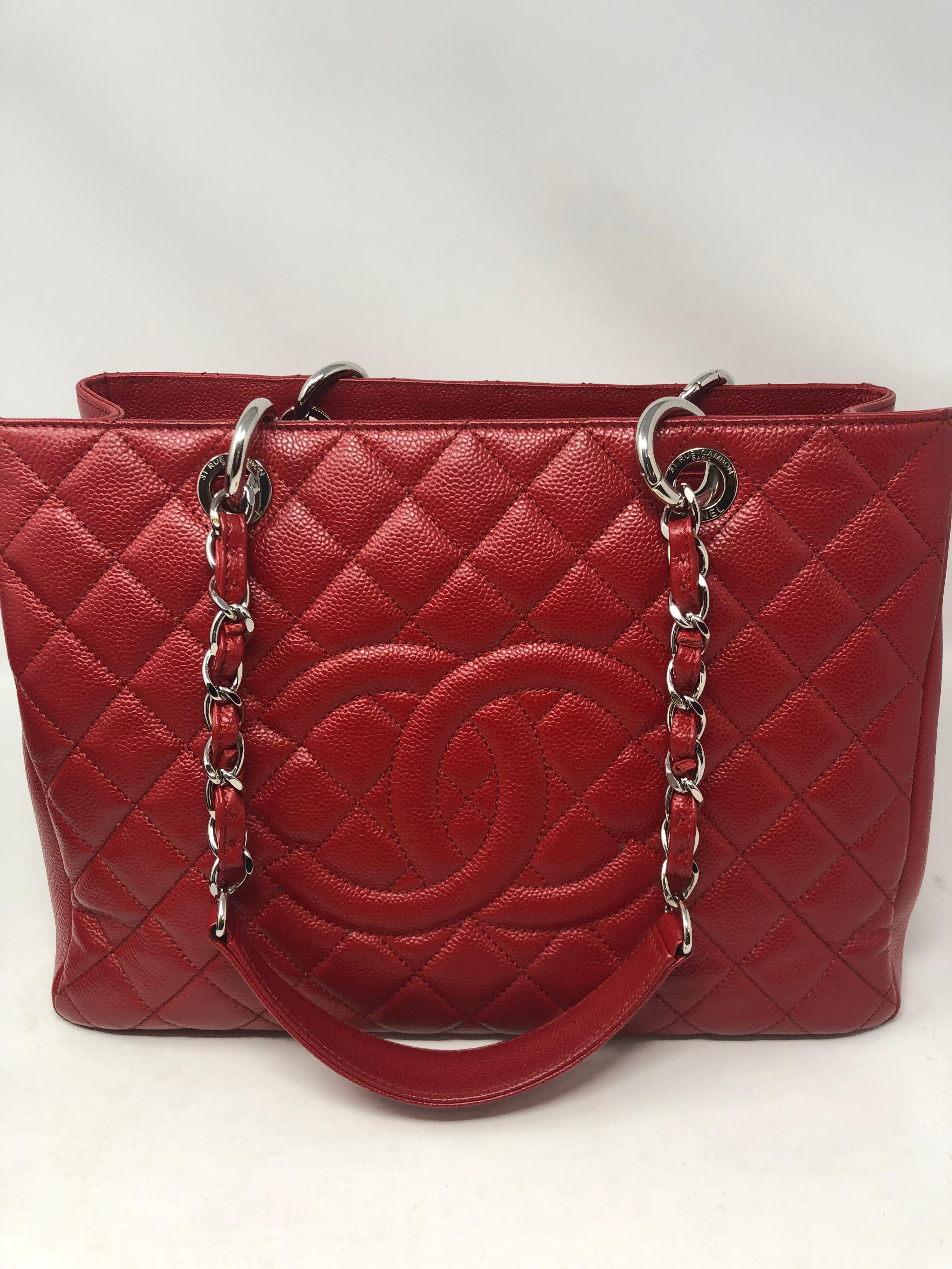 Chanel Red Caviar Leather Grand Shopper Tote. Silver hardware in excellent condition. Exterior is in like new condition. Beautiful and rare red color. GST bags are retired from Chanel so hard to find. Authenticity card included. Guaranteed