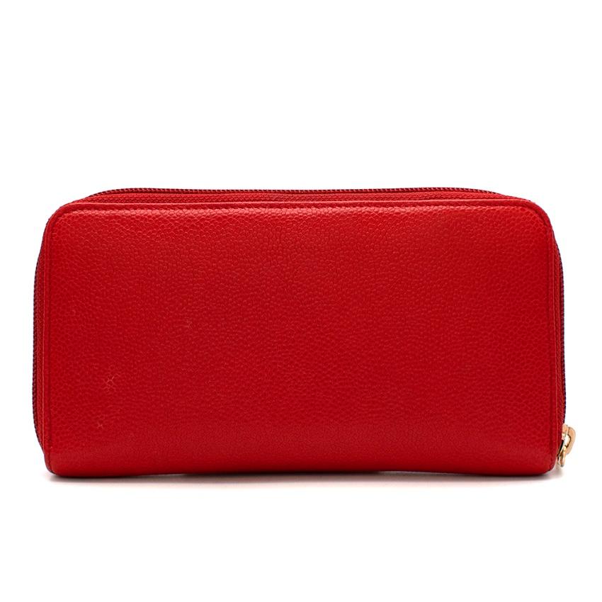 Chanel Red Grainy Leather CC Zipper Long Wallet

-Made of sturdy grainy leather  for resistance 
-Rich red color 
-Legendary Chanel CC logo quilted top stitching to the front 
-Zip fastening to the top 
-Golden branded zip handle 
-The interior is