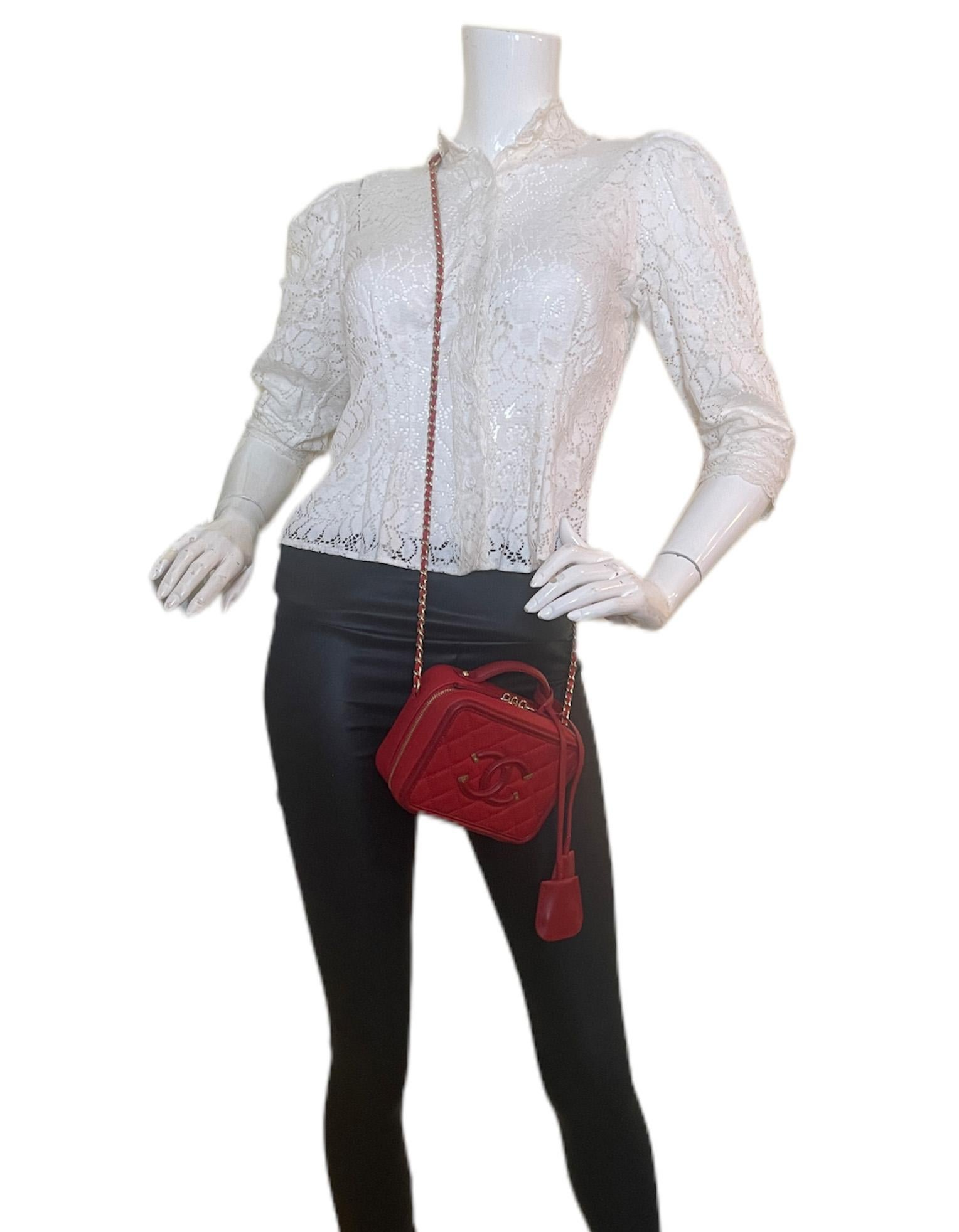 Chanel Red Caviar Quilted Small CC Filigree Vanity Case Crossbody Bag

Made In: Italy
Year of Production: 2017
Color: Red
Hardware: Red
Materials: Caviar leather
Lining: Red leather
Closure/Opening: Two zip
Interior Pockets: Two compartments, one