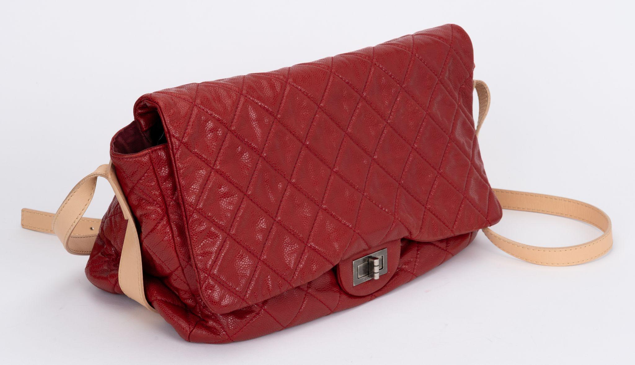 Chanel red caviar reissue jumbo cross body bag. Natural cowhide strap and details. Shoulder drop adjustable 22