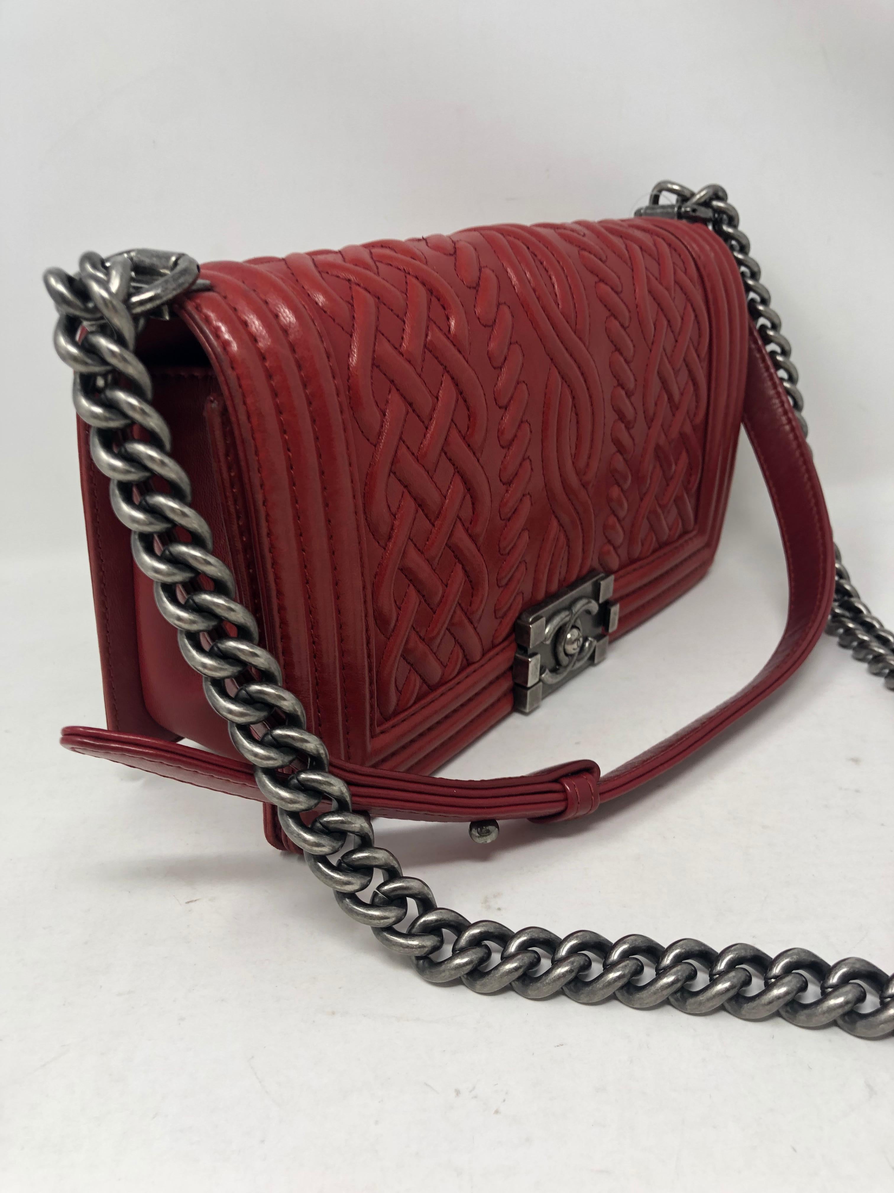 Chanel Red Celtic Boy Bag with ruthenium hardware. From the limited Paris-Edinburgh 2013 Collection. Medium size Boy Bag. Good condition light wear throughout and clean interior. Beautiful red leather that will turn heads. Guaranteed authentic. 