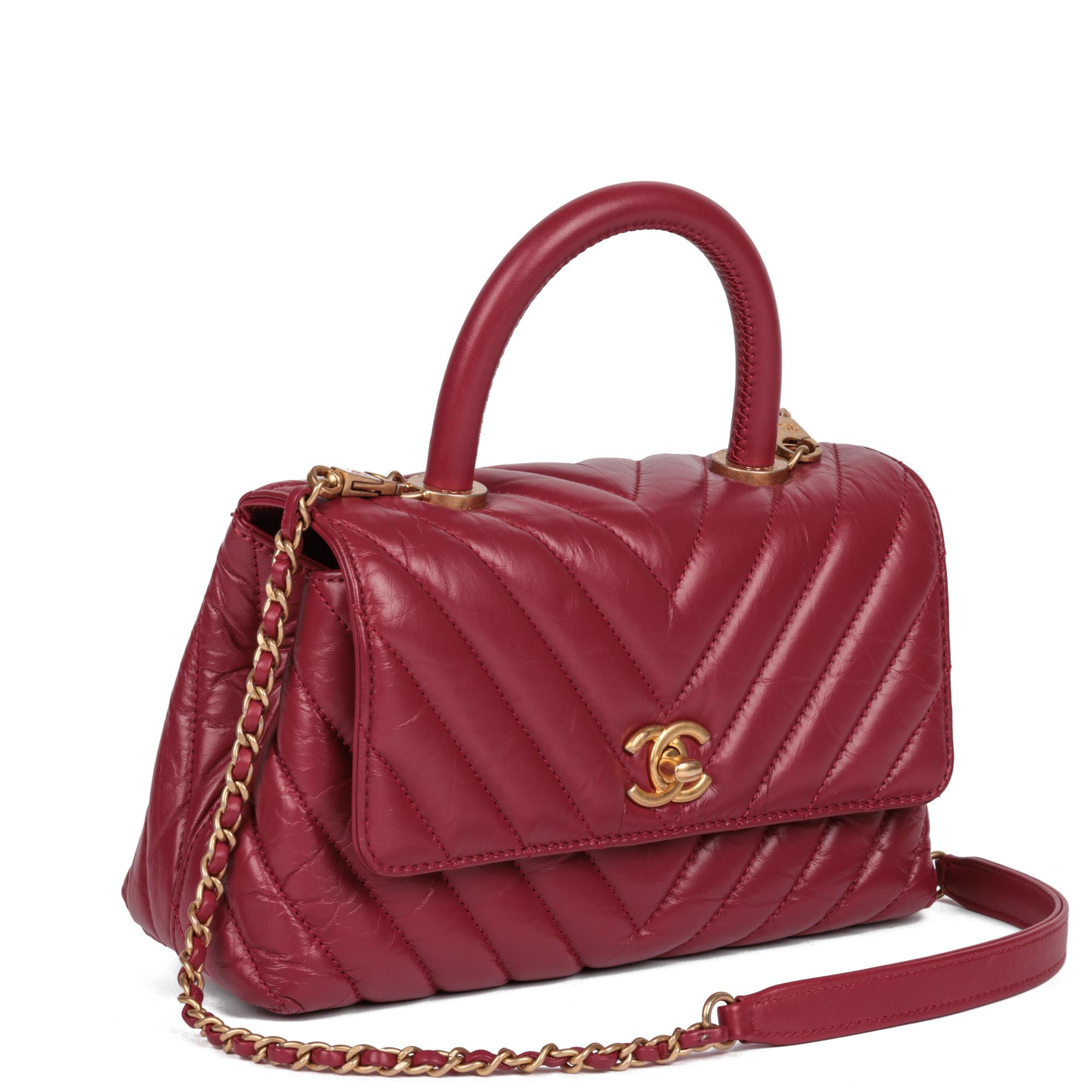 Chanel
Red Chevron Aged Calfskin Leather Small Coco Top Handle

Xupes Reference: HB5169
Serial Number: 26814854
Age (Circa): 2018
Accompanied By: Chanel Dust Bag, Authenticity Card
Authenticity Details: Authenticity Card, Serial Sticker (Made in