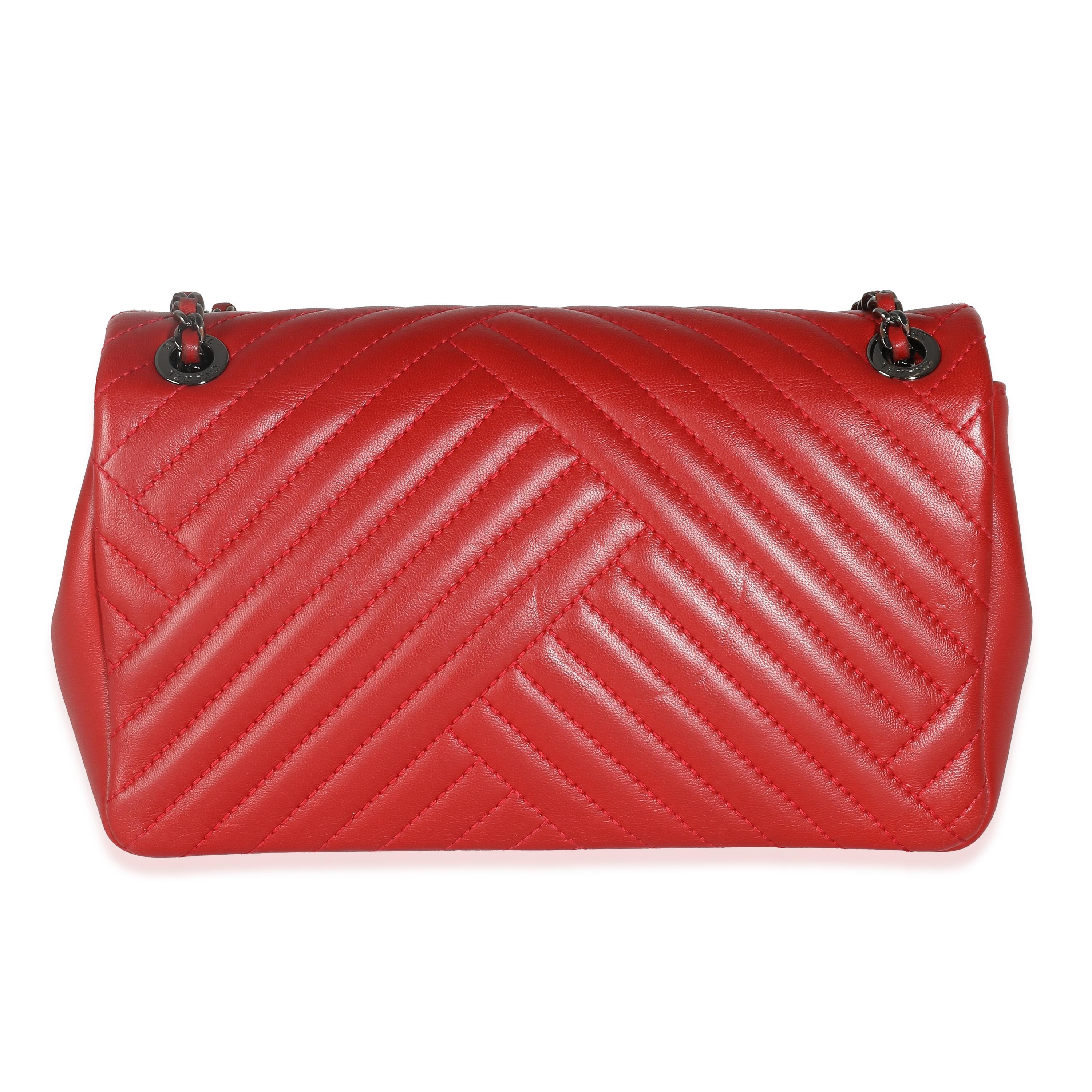 Listing Title: Chanel Red Chevron Lambskin Small CC Crossing Single Flap Bag
SKU: 139992
Condition: Pre-owned 
Handbag Condition: Very Good
Condition Comments: Item is in very good condition with minor signs of wear.  Plastic is partially peeled off