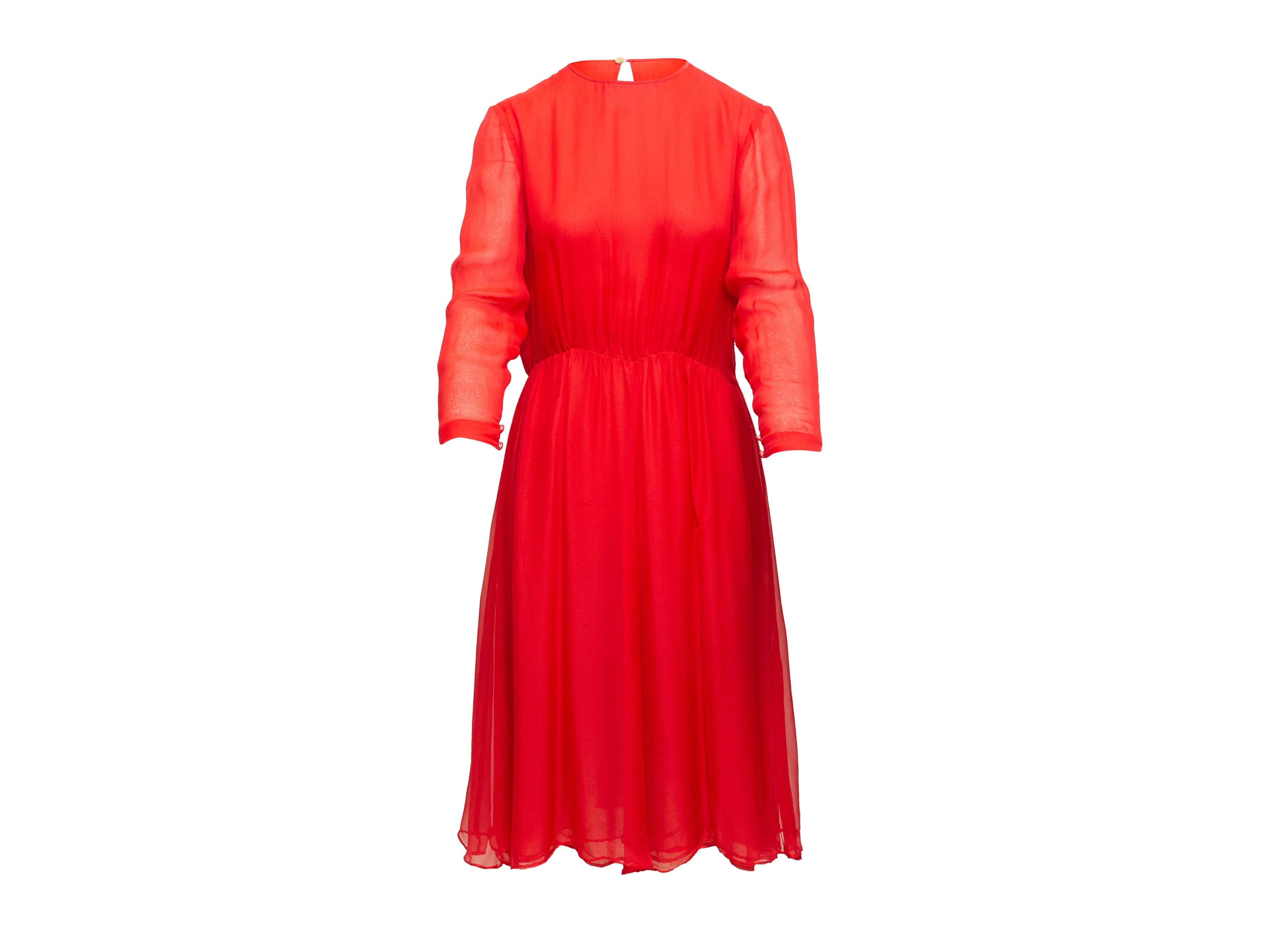 Product details: Vintage red silk midi dress by Chanel Creations. Crew neck. Long sleeves. Button closure at nape. 35