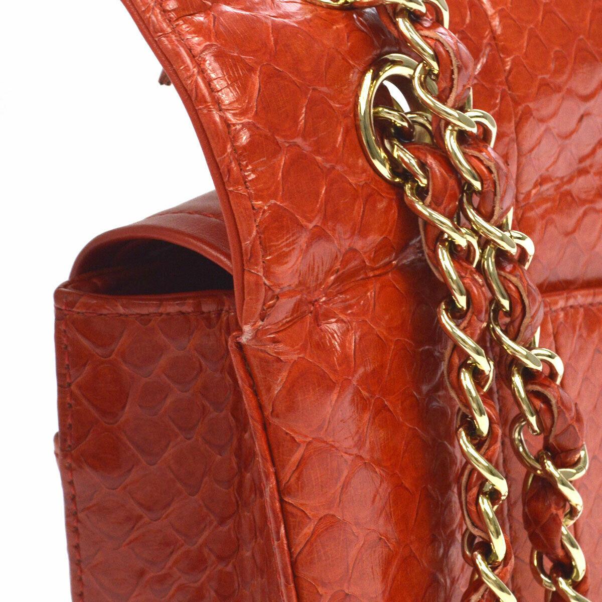 Chanel Red Snakeskin Exotic Leather Gold Evening Double Shoulder Flap Bag

Snakeskin 
Leather 
Gold tone hardware 
Leather lining
Turnlock closure
Date code present
Made in France
Shoulder strap drop 15.5