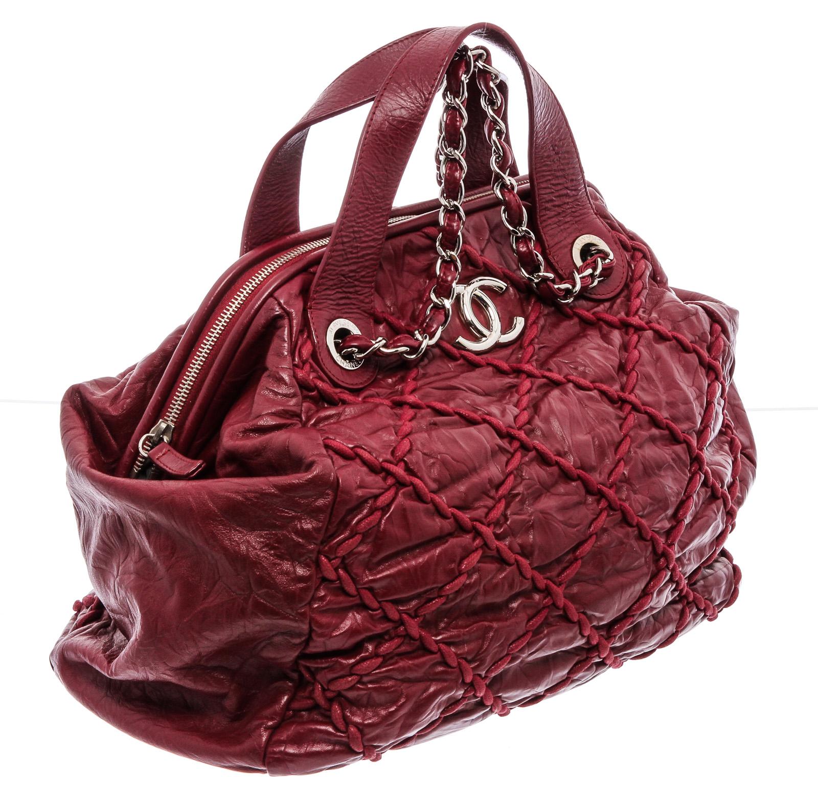 Red distressed leather Chanel Bowler bag with silver-tone hardware, dual chain-link and leather shoulder straps, dual flat top handles, tonal quilted Ultra Stitch accents at exterior, CC logo adornment at front, protective feet at base, grey