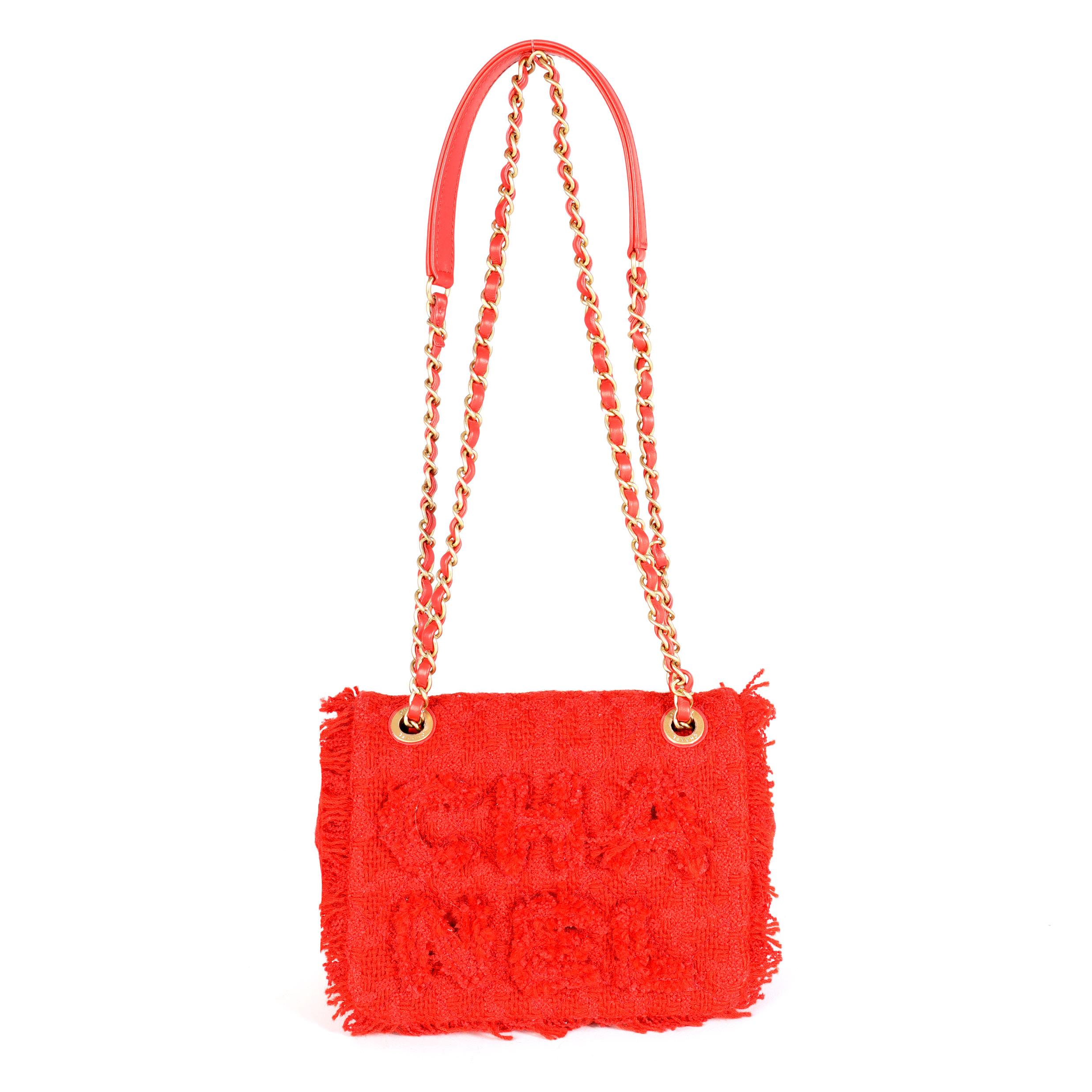 Listing Title: Chanel Red Frayed Tweed 'Chanel' Flap Bag
SKU: 114503

Handbag Condition: Excellent
Condition Comments: Excellent Condition. Plastic on some hardware. Scratching to hardware. No other visible signs of wear.
Brand: Chanel
Model: Tweed