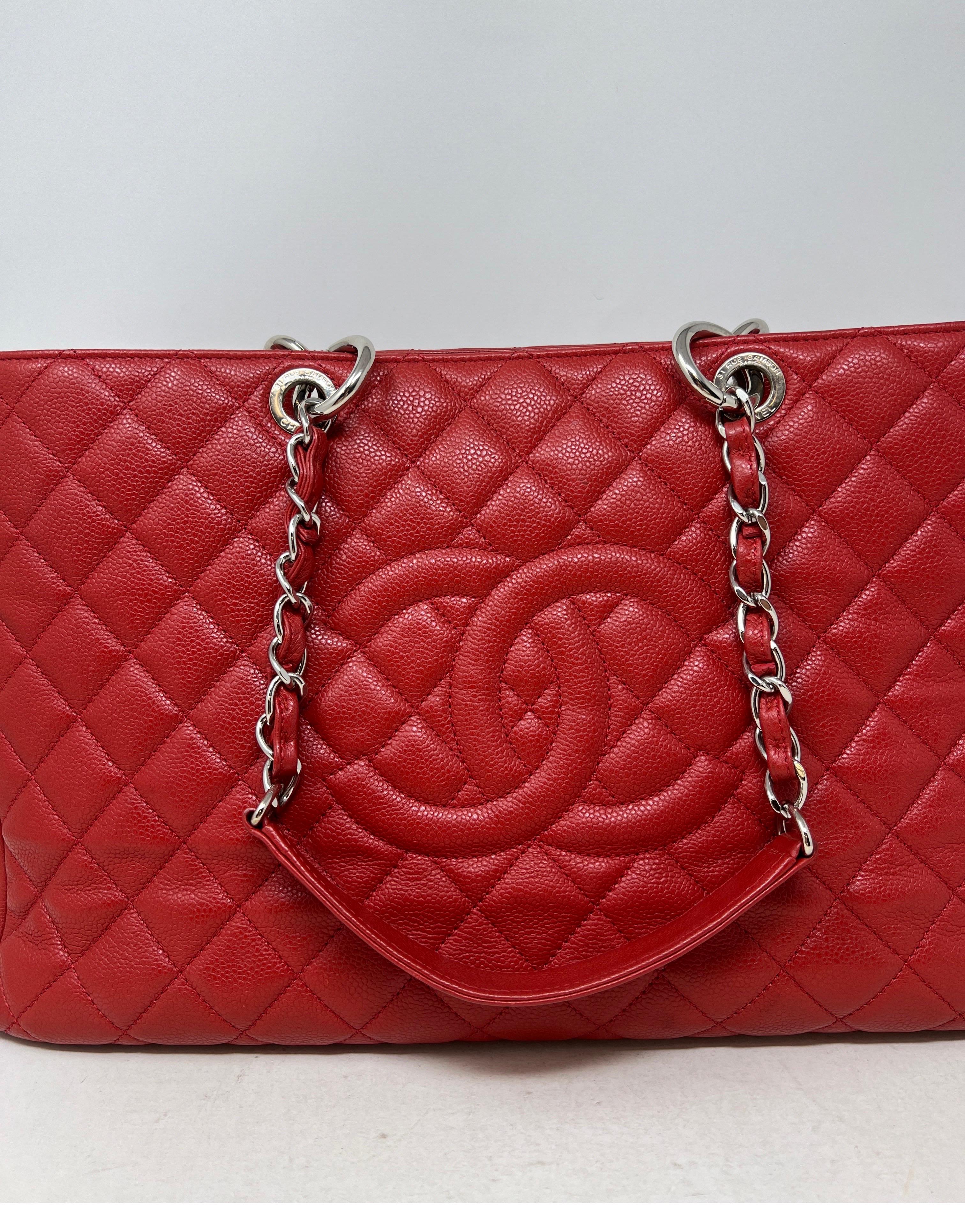 Chanel Red Grand Shopper XL Tote Bag. Silver hardware. Retired style from Chanel. Collector's piece. Interior clean. Bag looks almost new. XL size tote. Caviar leather is very durable. Serial number inside bag. Guaranteed authentic. 