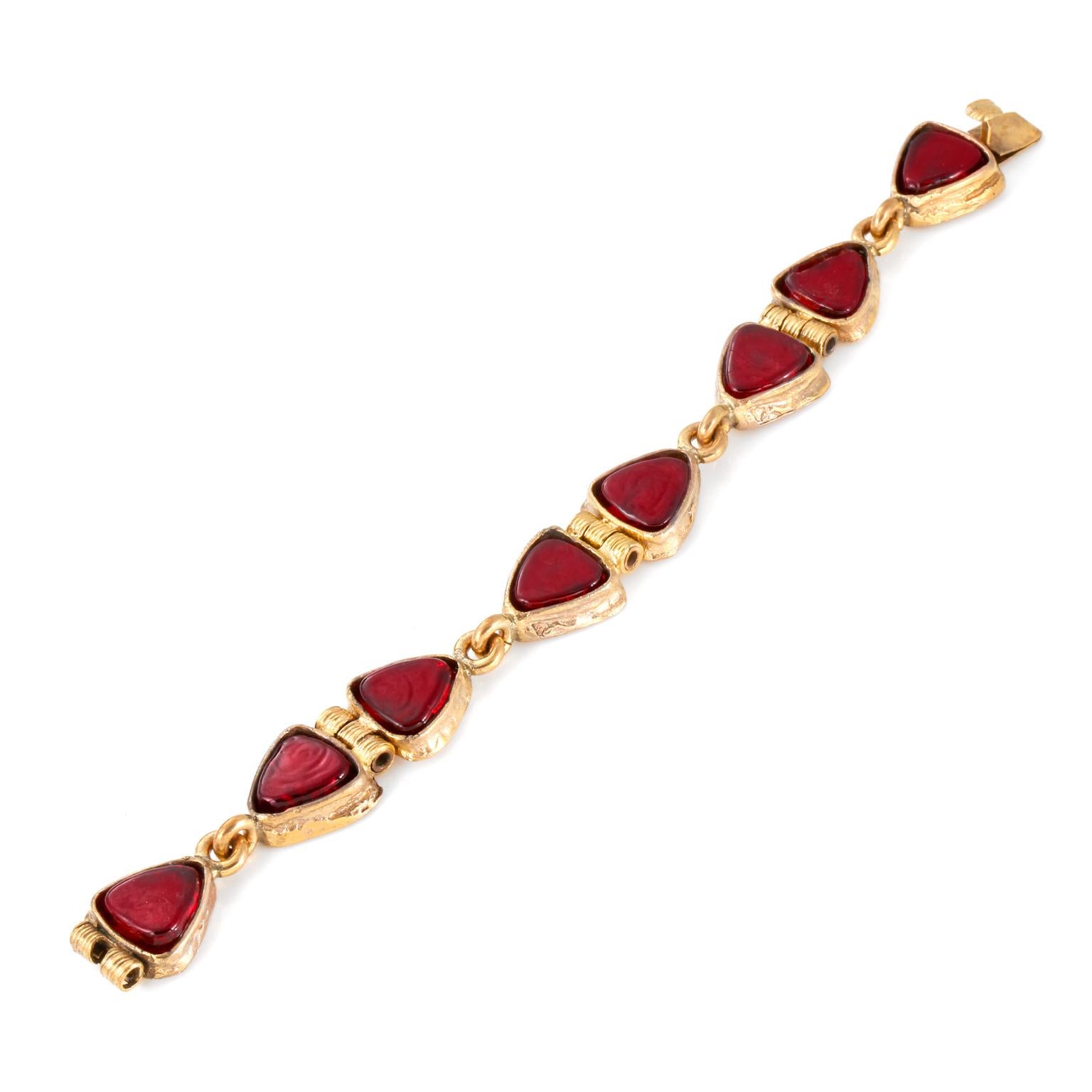 This authentic Chanel Red Gripoix Bracelet is in exceptionally good vintage condition.  It is a very early Chanel piece from the 1954-1971 era. Deep red Gripoix glass stones set in gold tone metal.  Approximately 8 inches.    Pouch or box included.