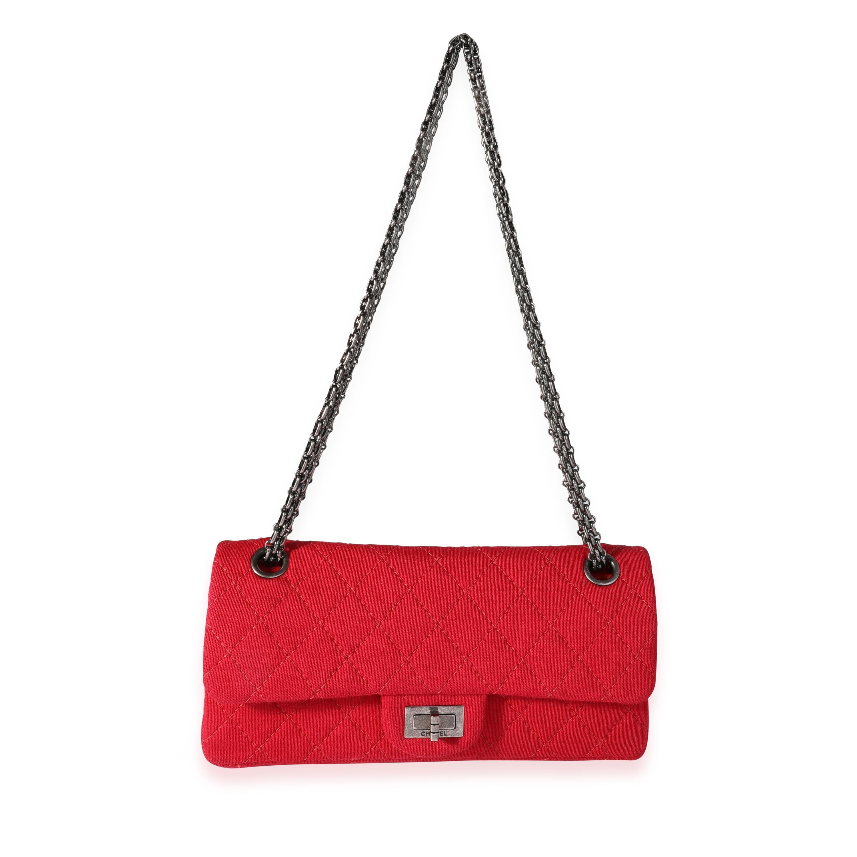 Listing Title: Chanel Red Jersey East West Reissue Double Flap Bag
SKU: 118315
Condition: Pre-owned (3000)
Handbag Condition: Very Good
Condition Comments: Very Good Condition. Creasing to bottom due to flat storage. Marks to jersey near hardware
